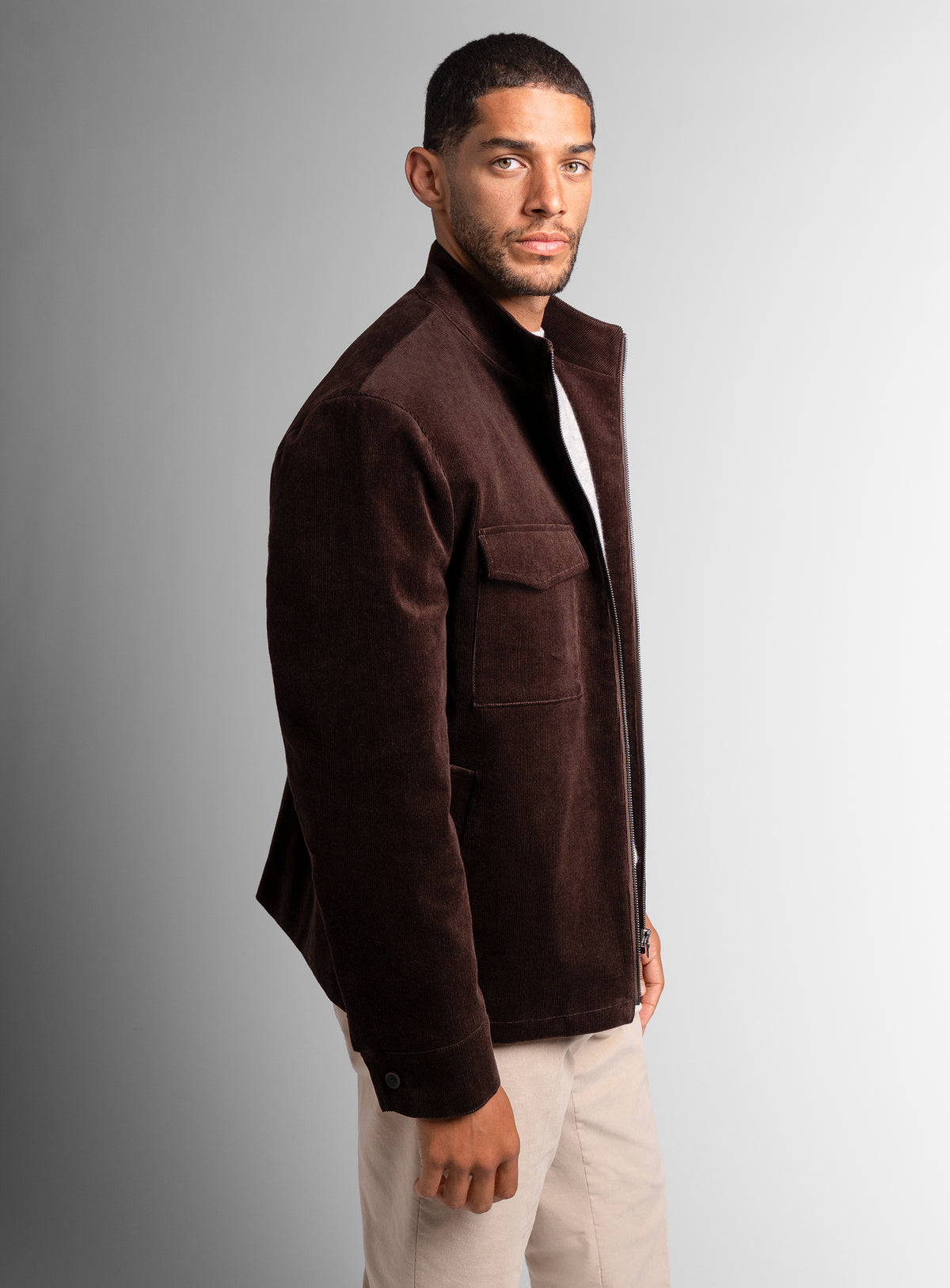 A side-view of the Aldor Corduroy Chocolate Brown Jacket