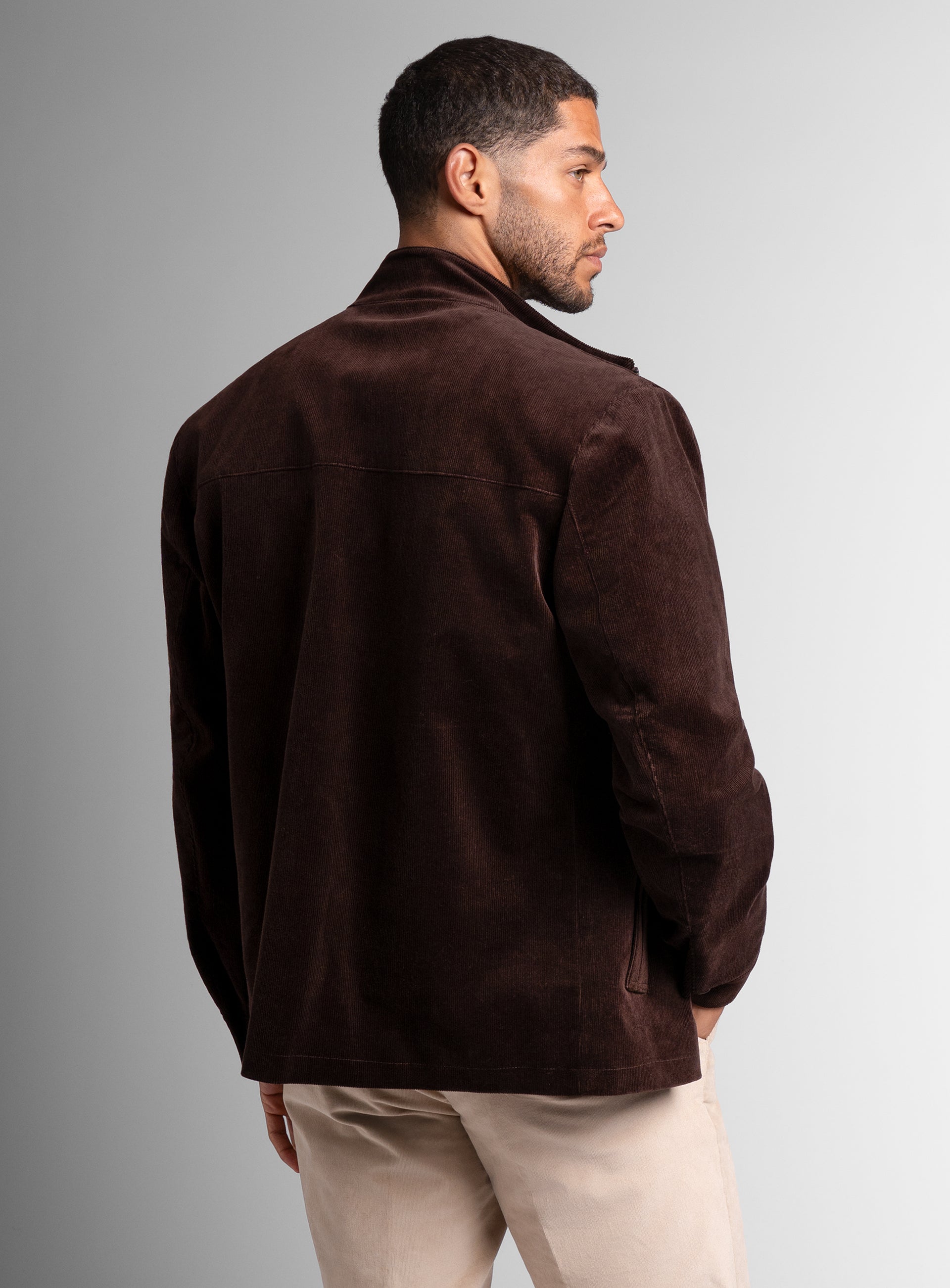 A back-side of the Aldor Corduroy Chocolate Brown Jacket