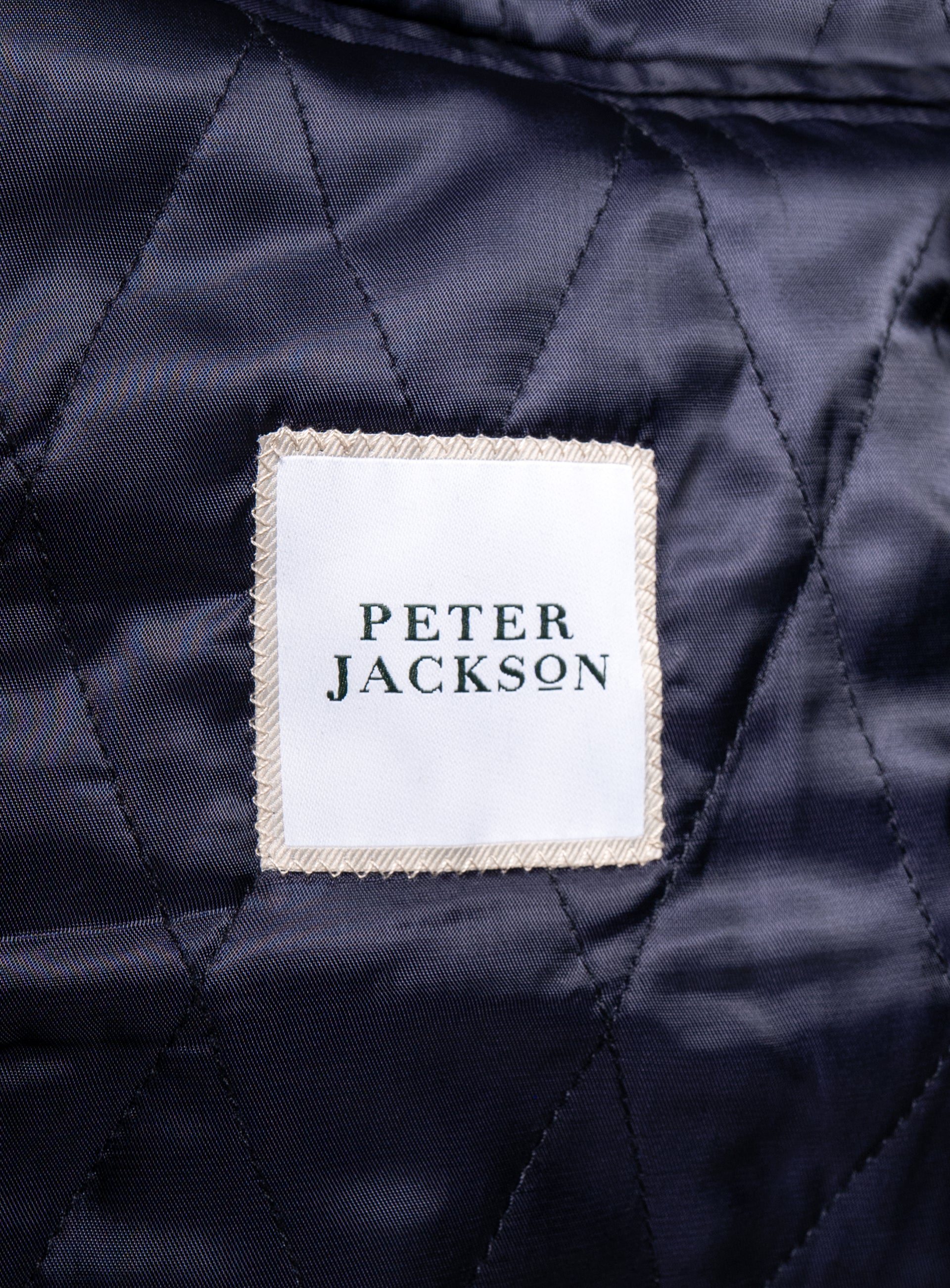 The "Peter Jackson" logo on the Aldor Corduroy Chocolate Brown Jacket