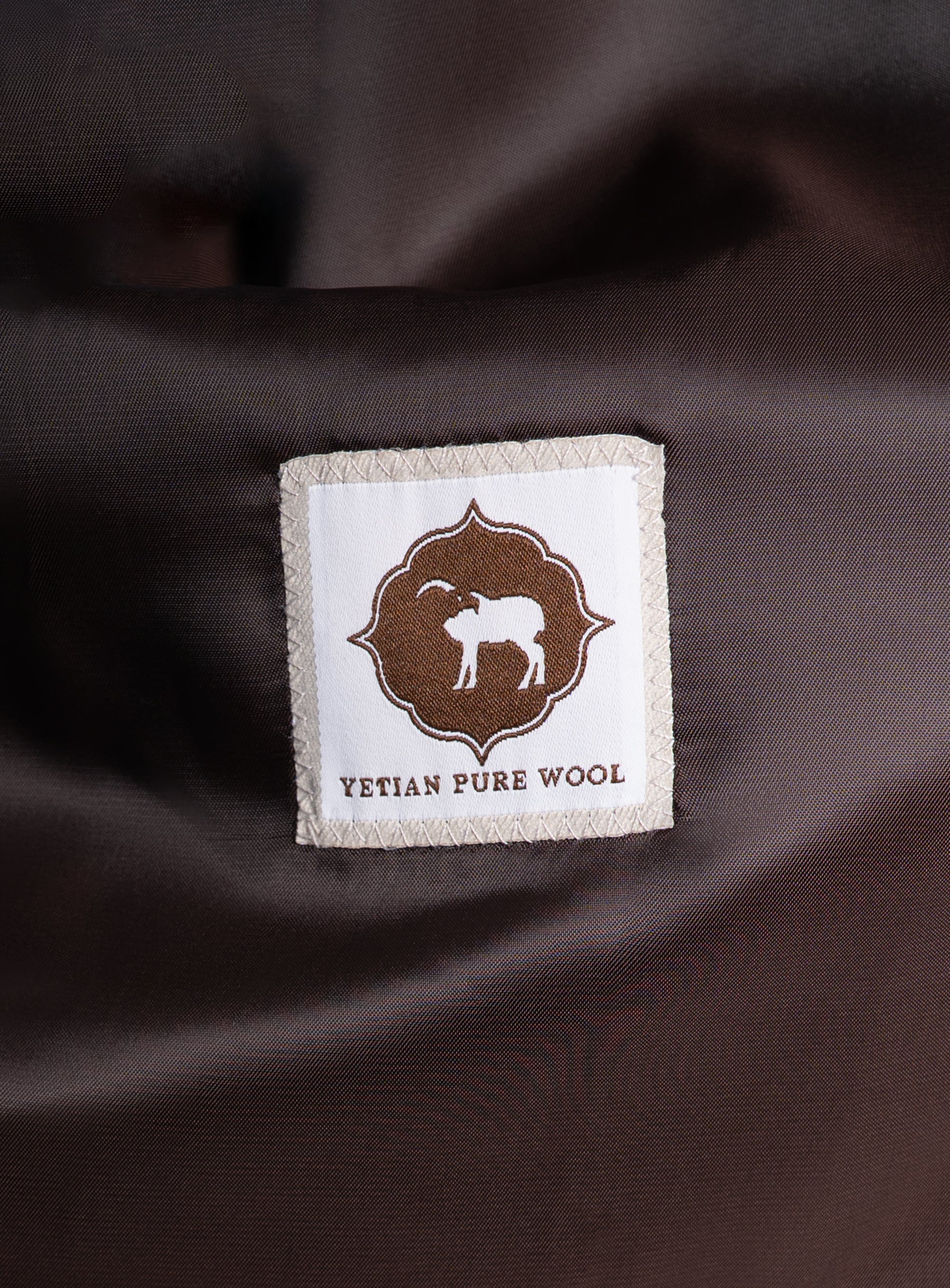 A label that says "Yetian Pure Wool" on the Orlando Chocolate Brown Jacket