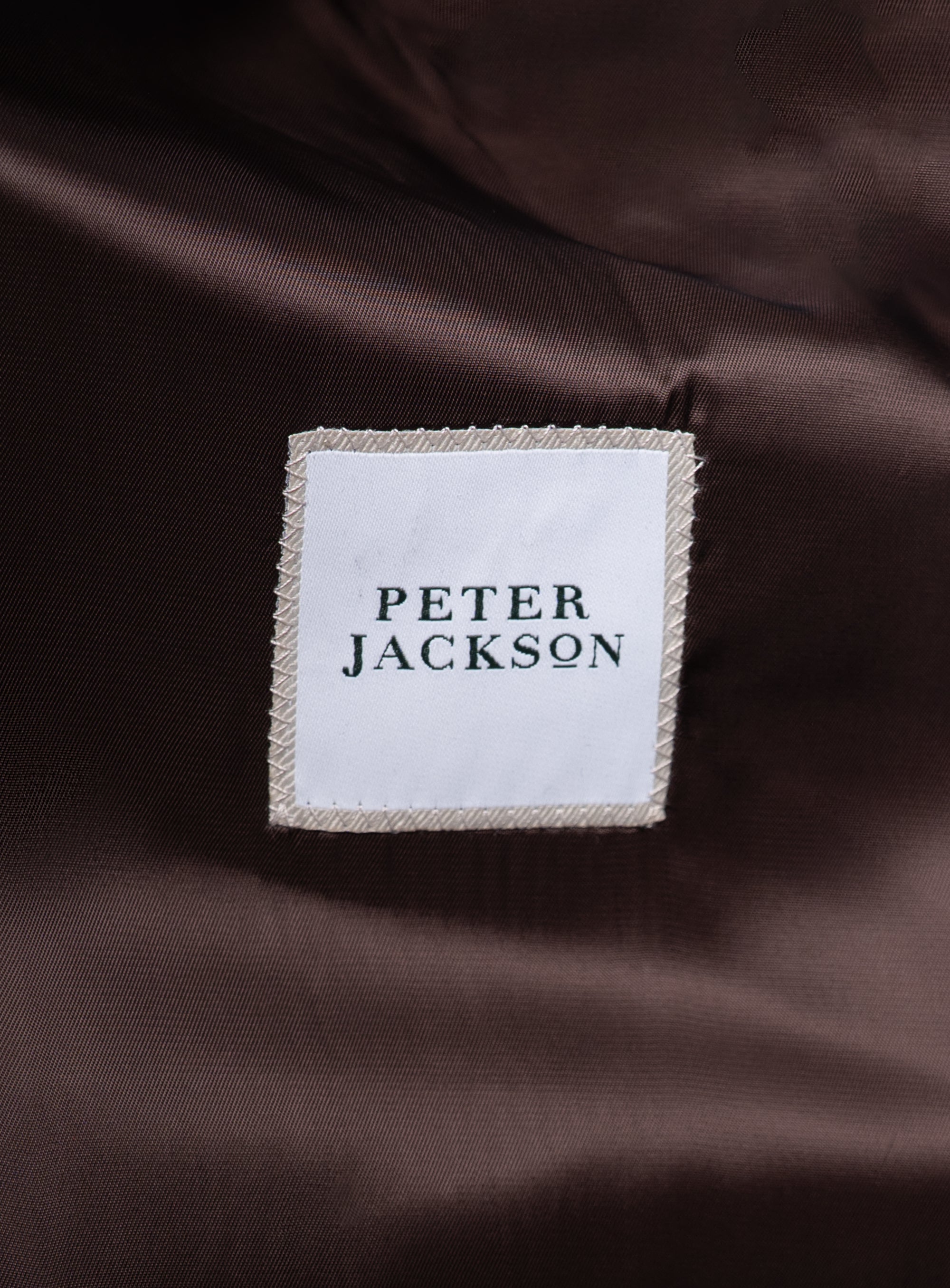 Close-up of the "Peter Jackson" logo on the Orlando Chocolate Brown Jacket