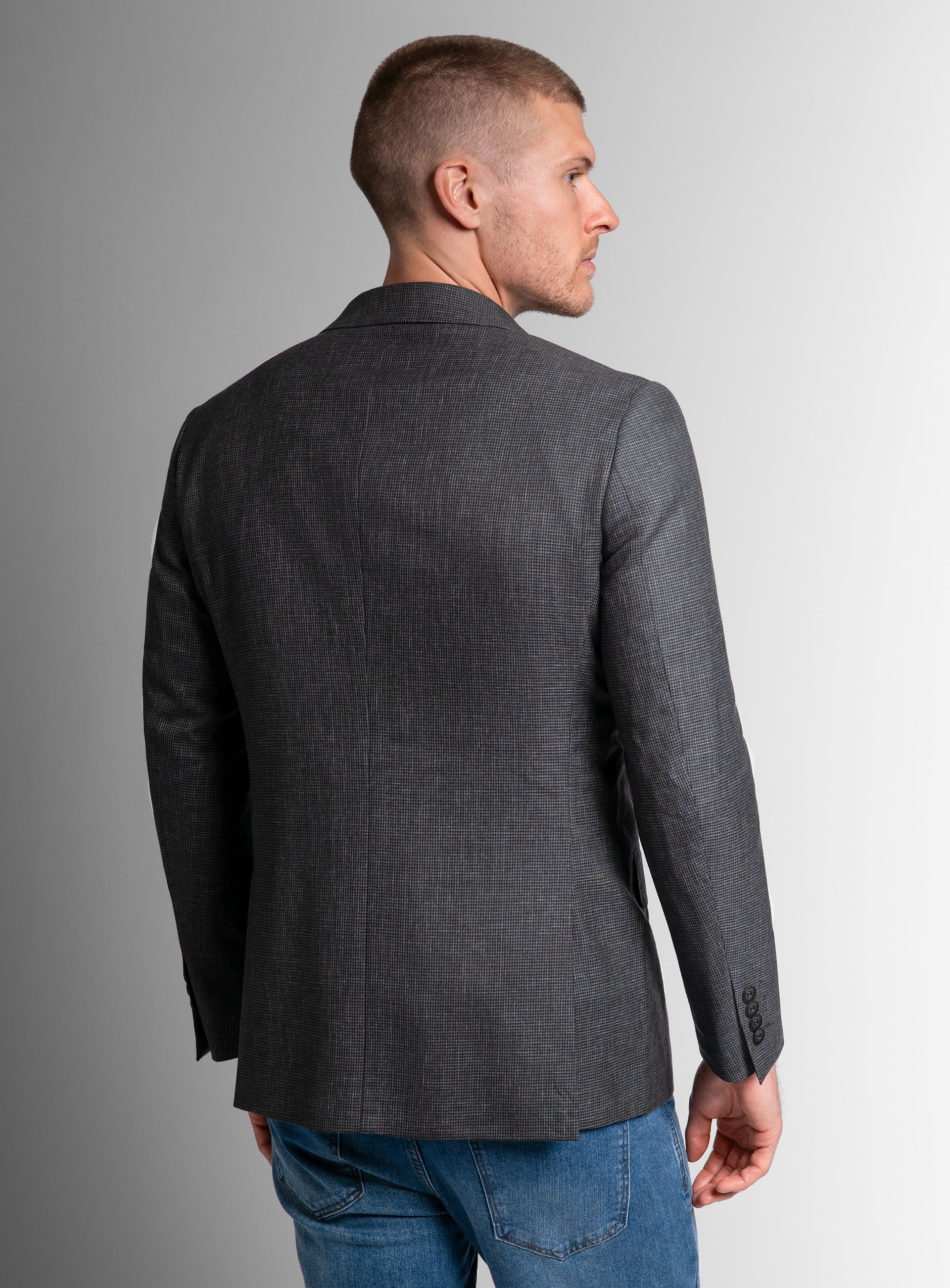 The back of the Portici Puppytooth Green Jacket