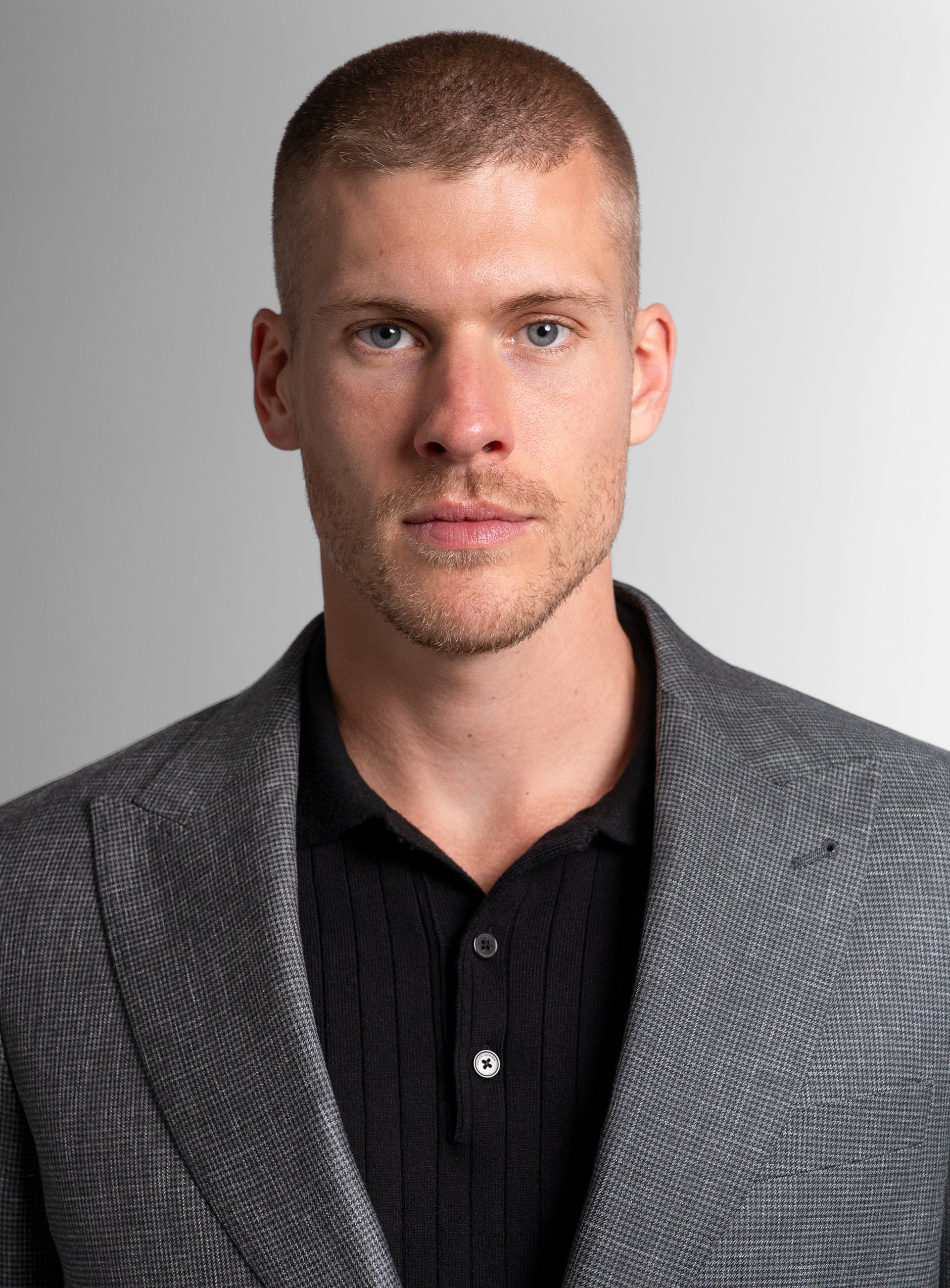 Close-up of a man wearing the Portici Puppytooth Green Jacket