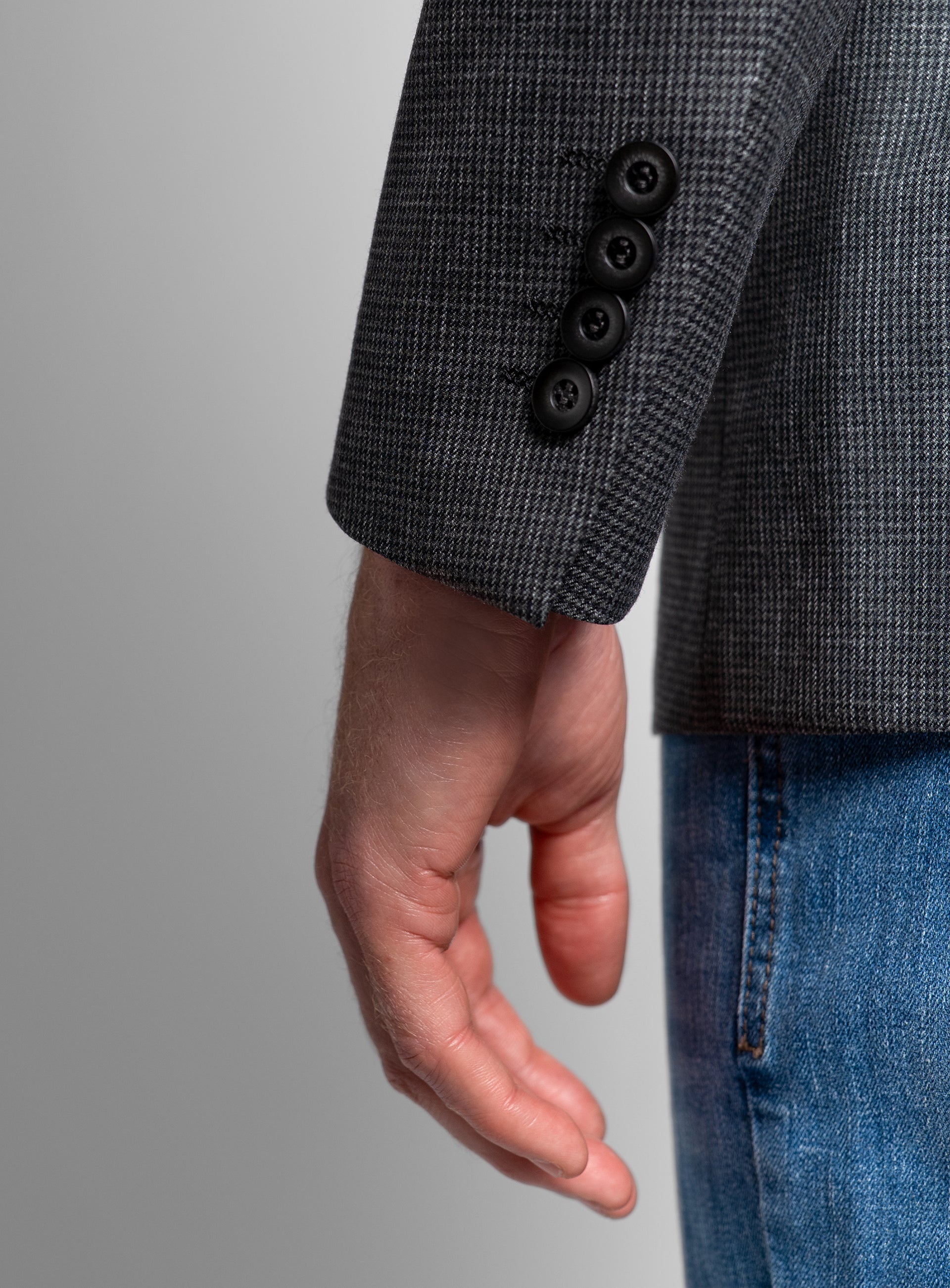 Close-up of the sleeves on the Portici Puppytooth Green Jacket