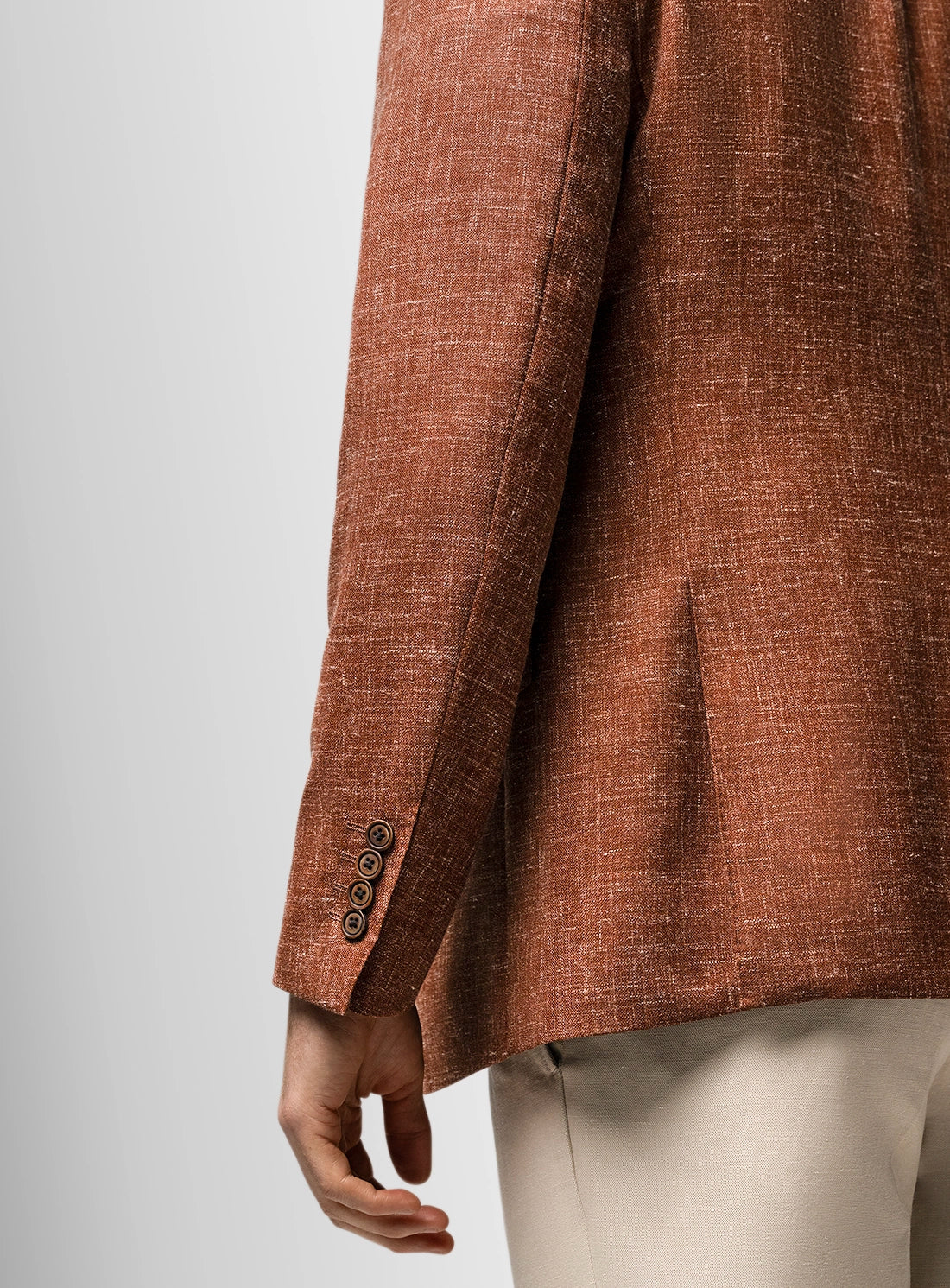 Brown textured blazer on a plain background