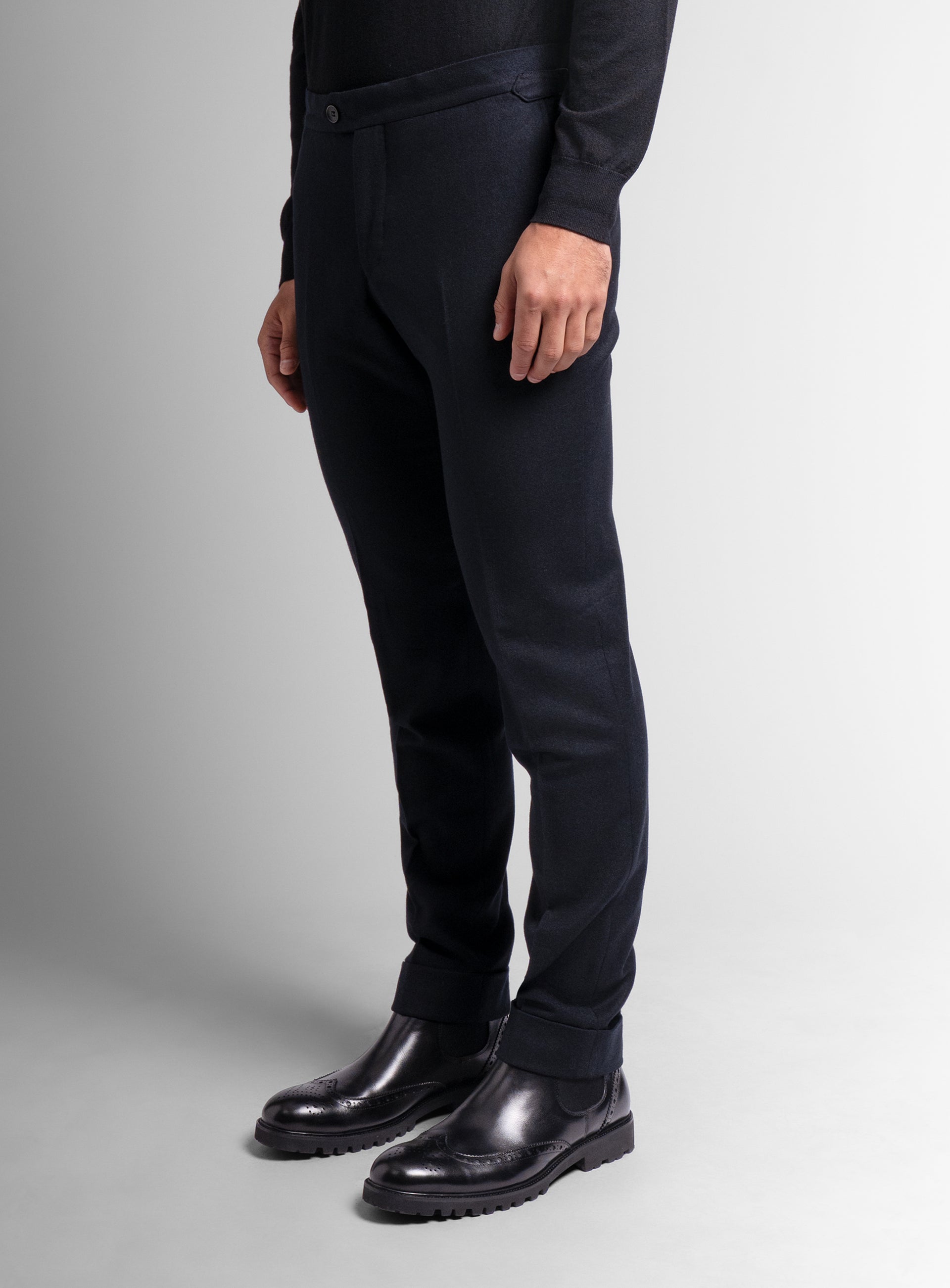 Man standing up straight while wearing the Argenta Black Wool Flannel Trousers