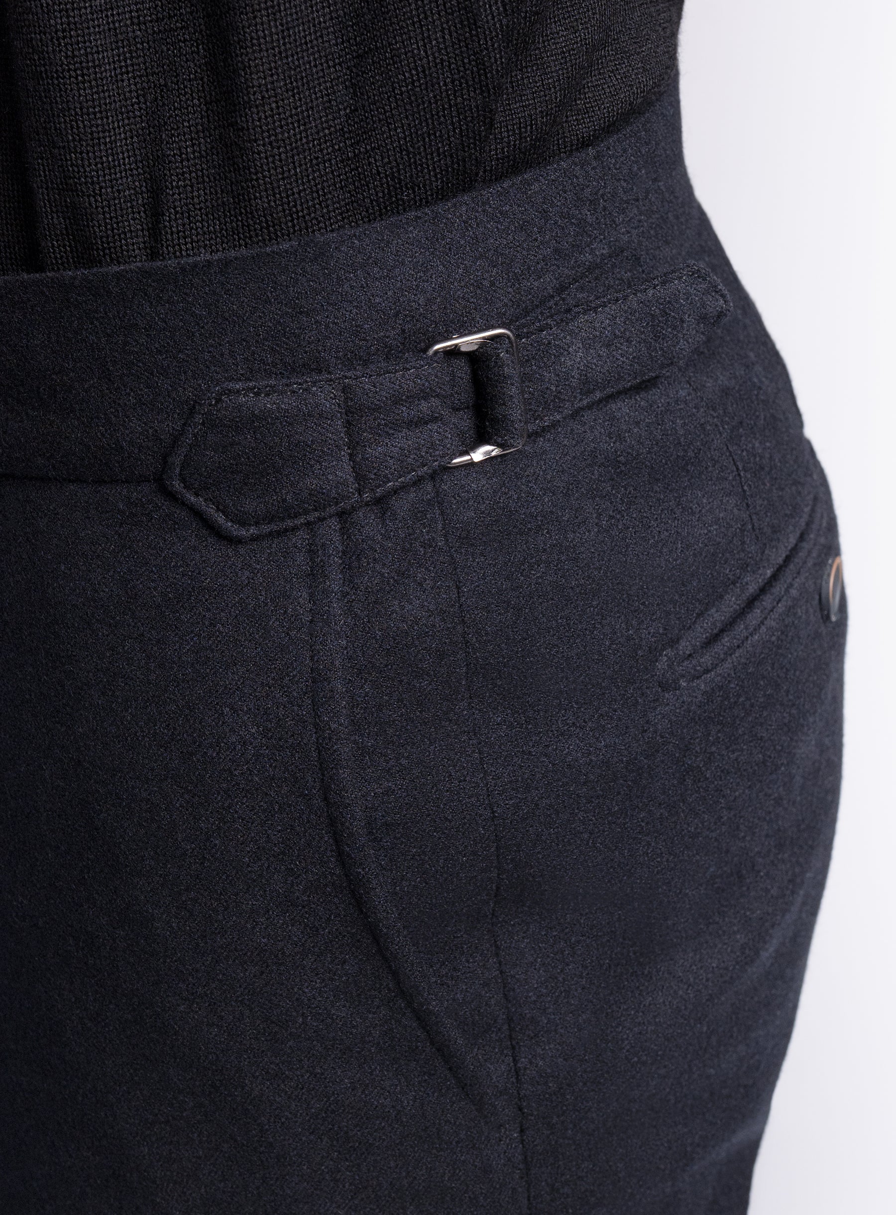 The side-adjusters on the Argenta Black Wool Flannel Trousers