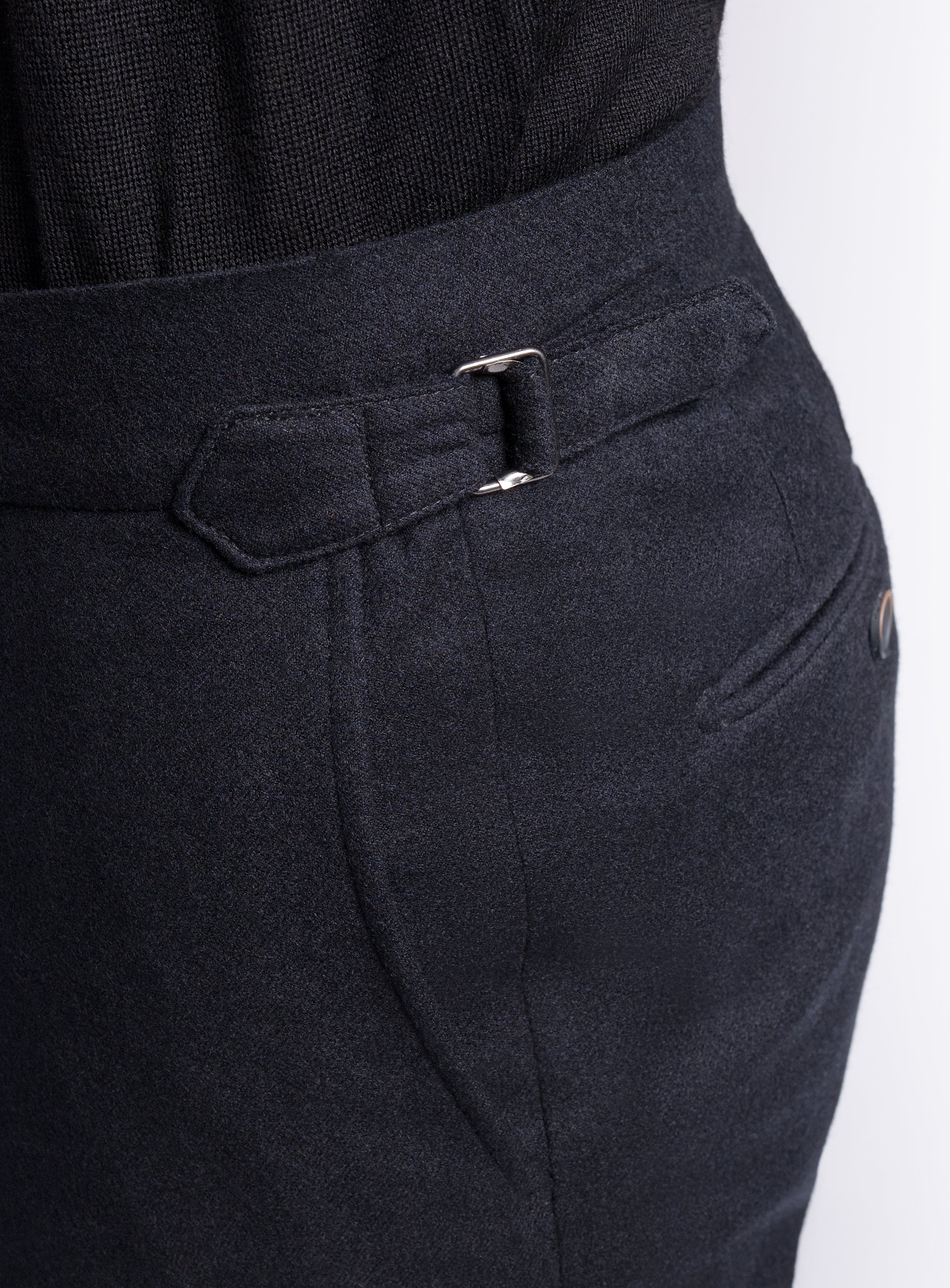 The side-adjusters on the Argenta Black Wool Flannel Trousers
