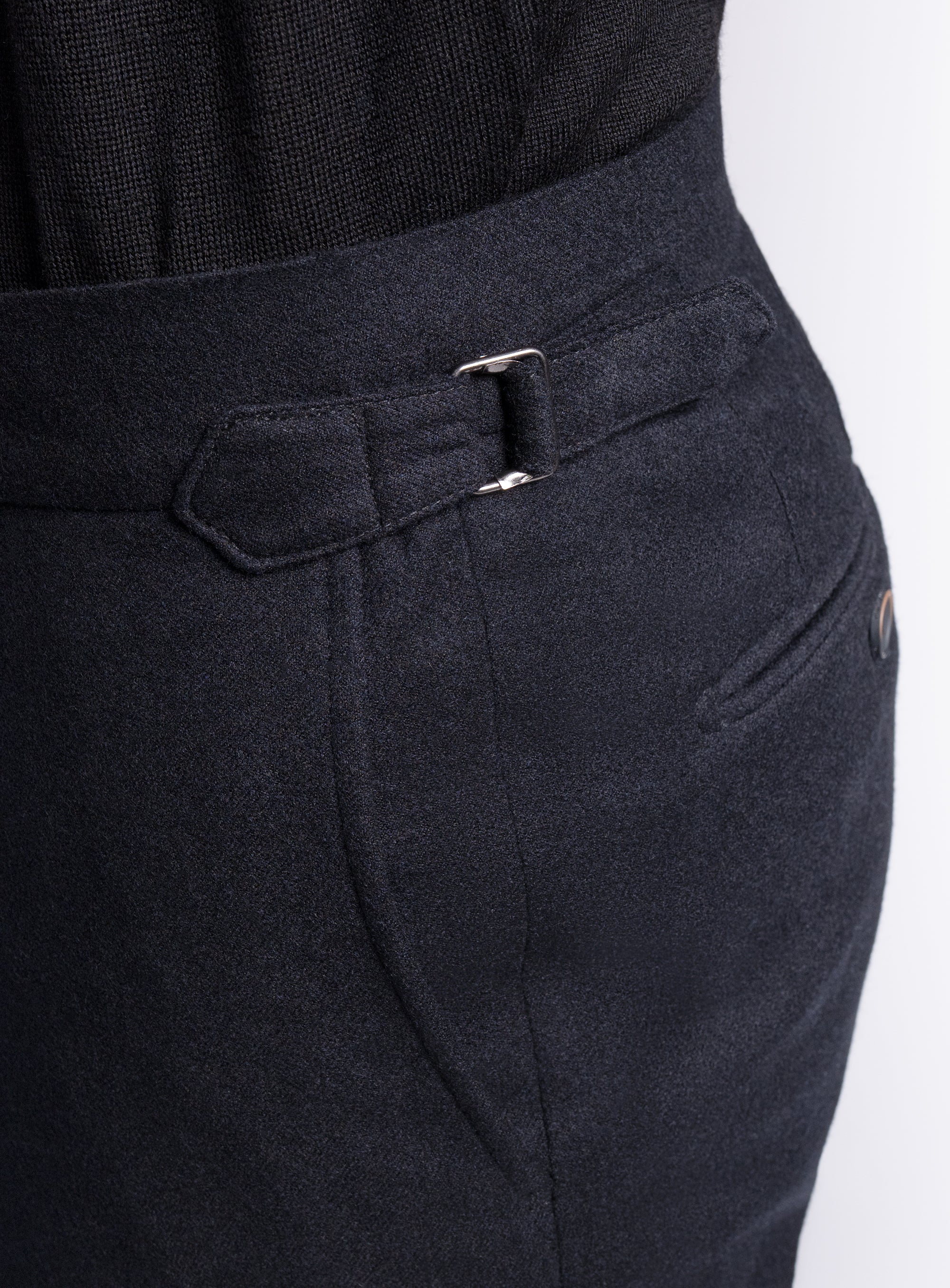 The side-adjusters on the Argenta Black Wool Flannel Trousers