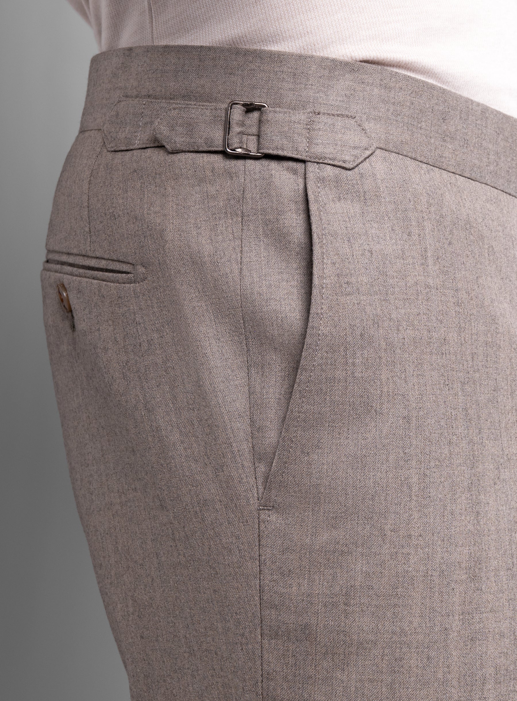 The side-adjusters on the Argenta Fawn Wool Flannel Trousers
