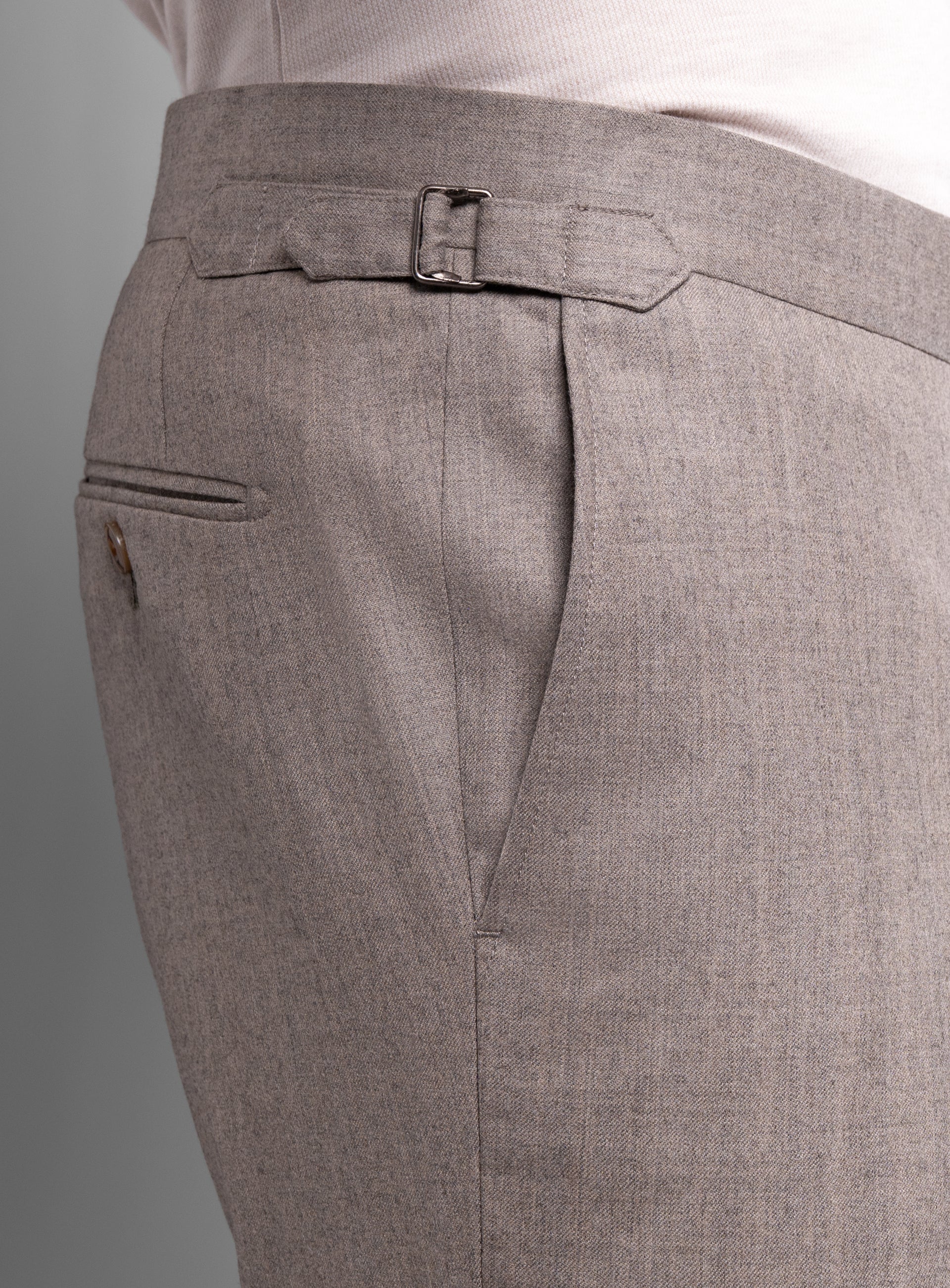 The side-adjusters on the Argenta Fawn Wool Flannel Trousers