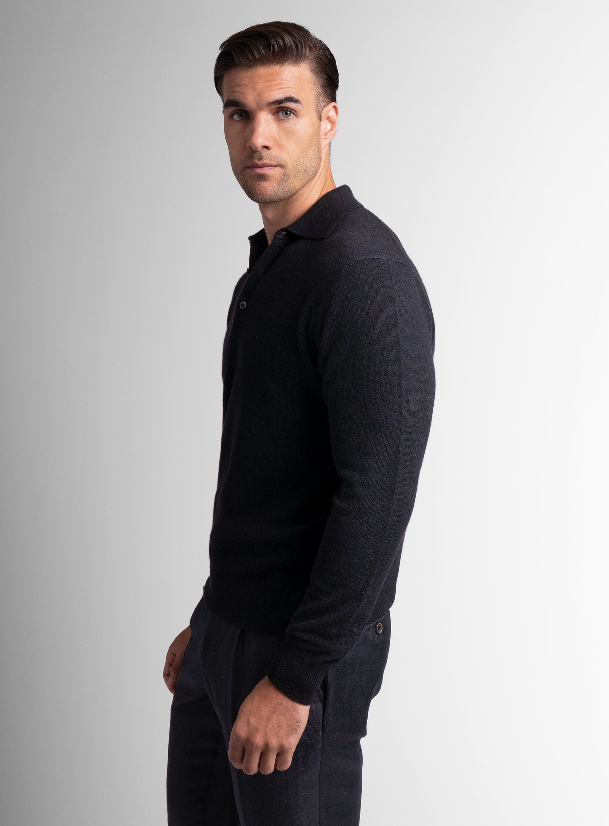 The side of the Wool/Cashmere Long Sleeve Black Polo Knit