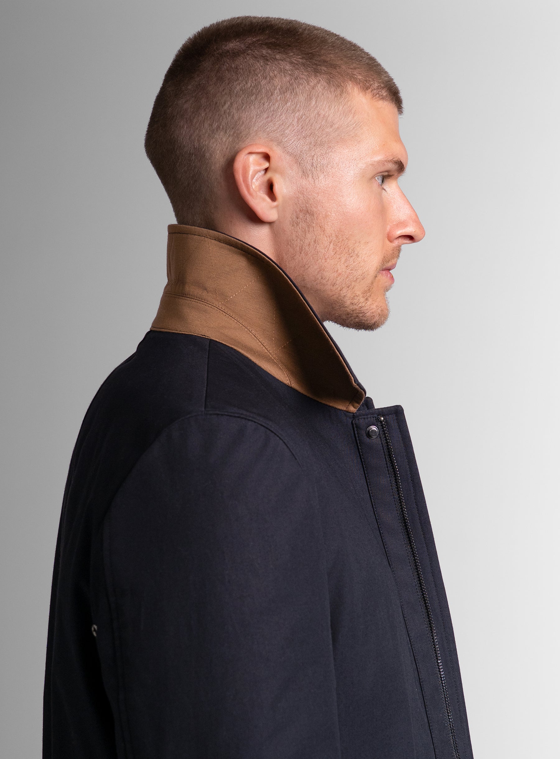 The side of the Lorenzo Navy Raincoat