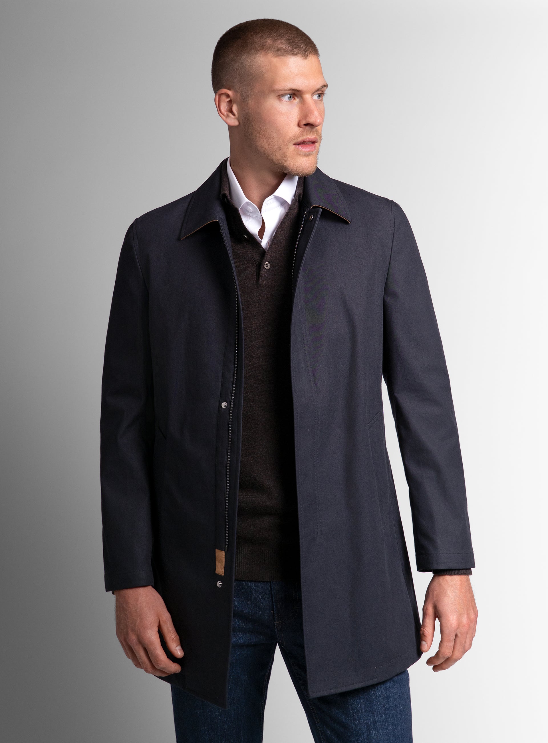 Man looking to his side wearing the Lorenzo Navy Raincoat