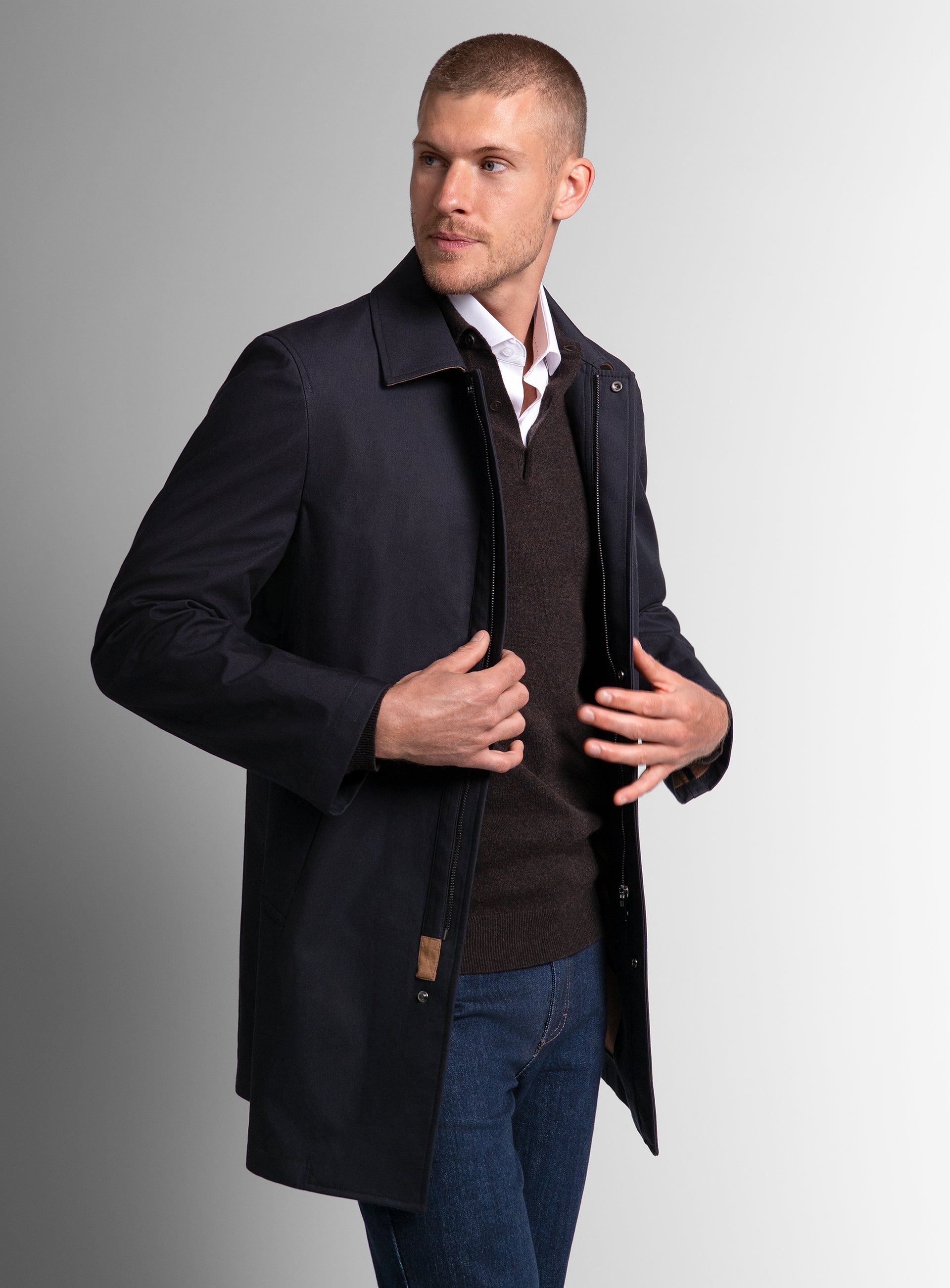 Man looking to his other side wearing the Lorenzo Navy Raincoat