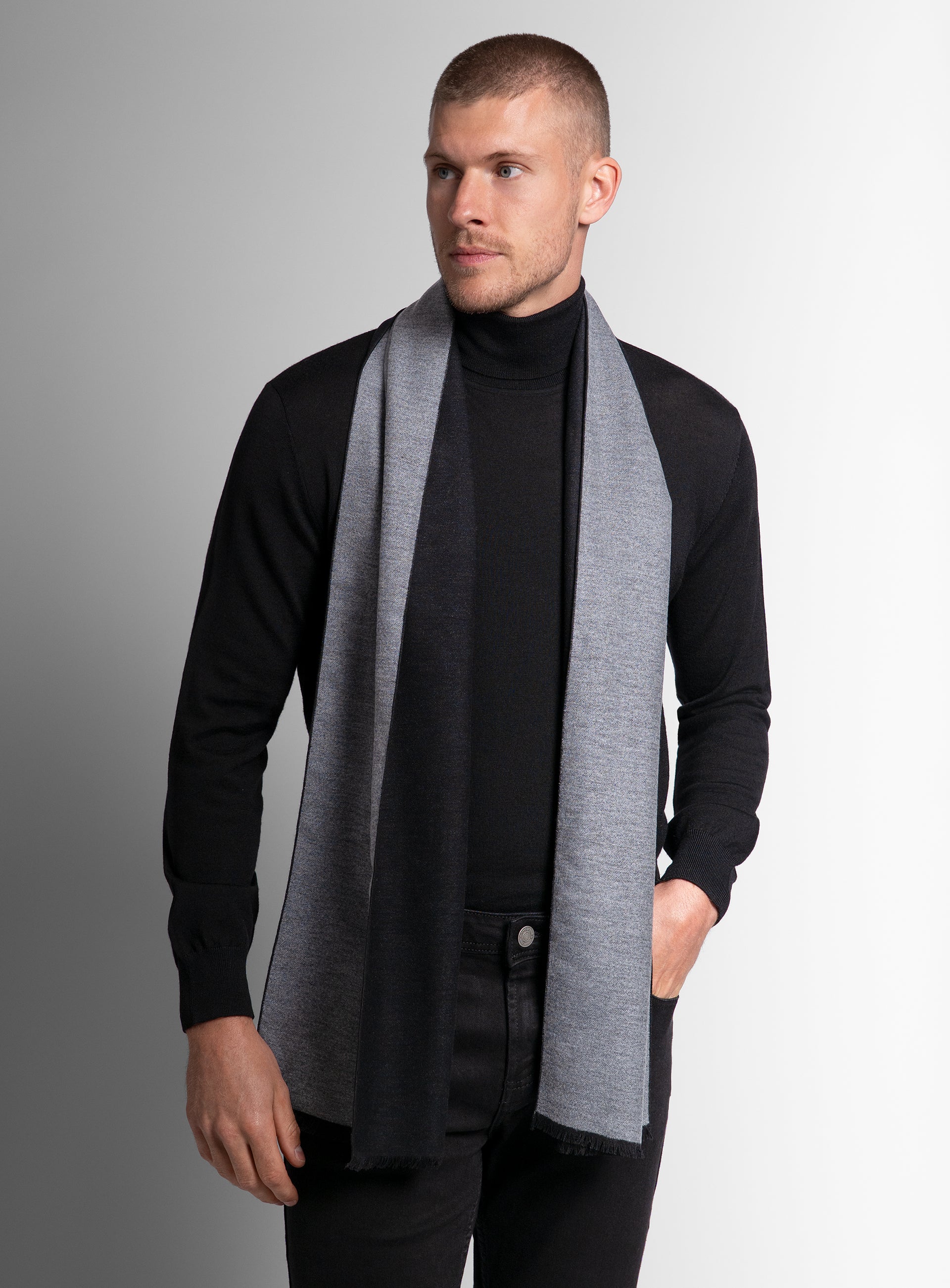 Picture of a man wearing the Black & Grey Silk Scarf with his hand in his pocket