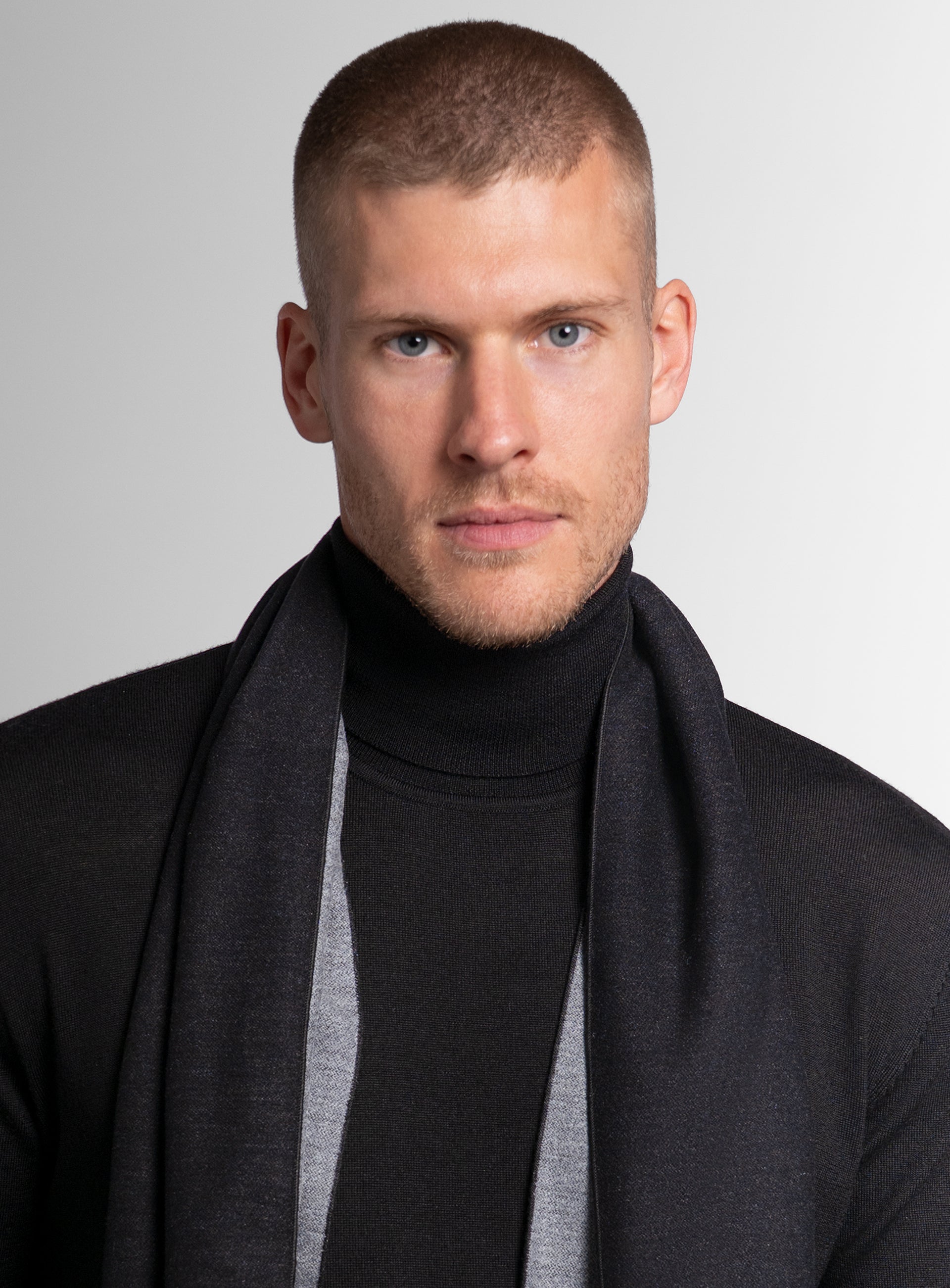 Close-up of a man wearing the Black & Grey Silk Scarf