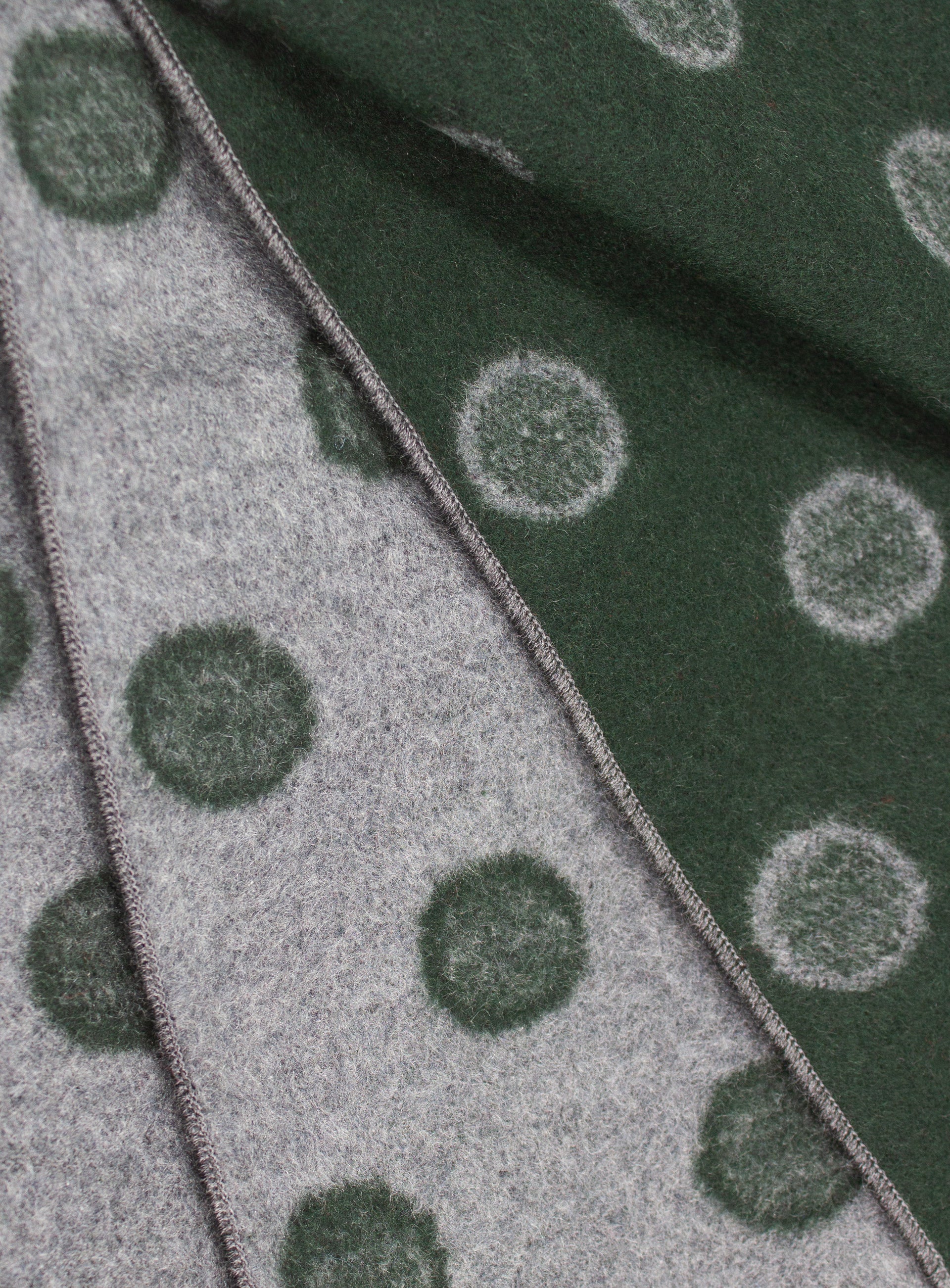 Close-up of both sides of the Green and Grey Dot Silk Scarf
