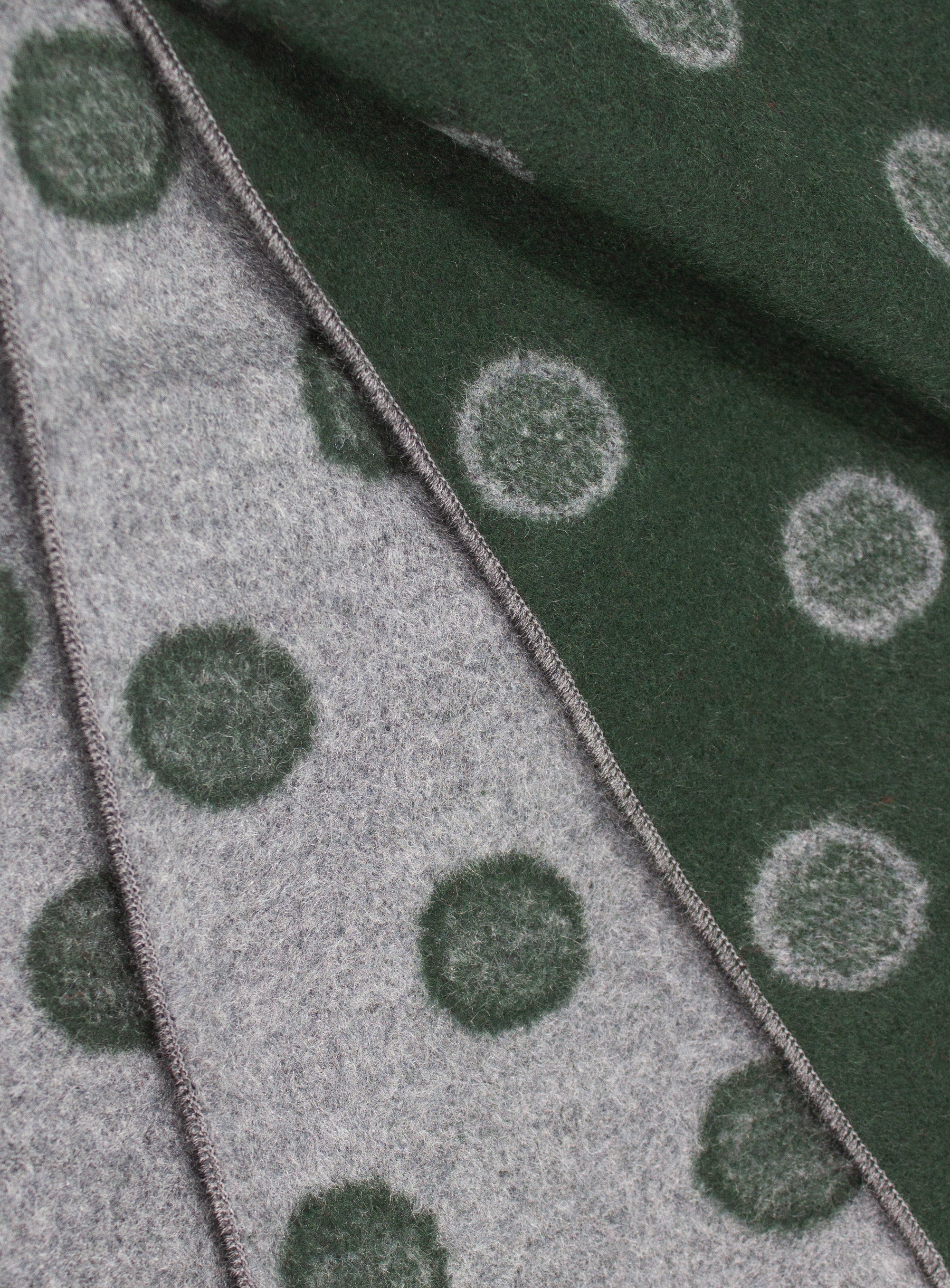 Close-up of both sides of the Green and Grey Dot Silk Scarf