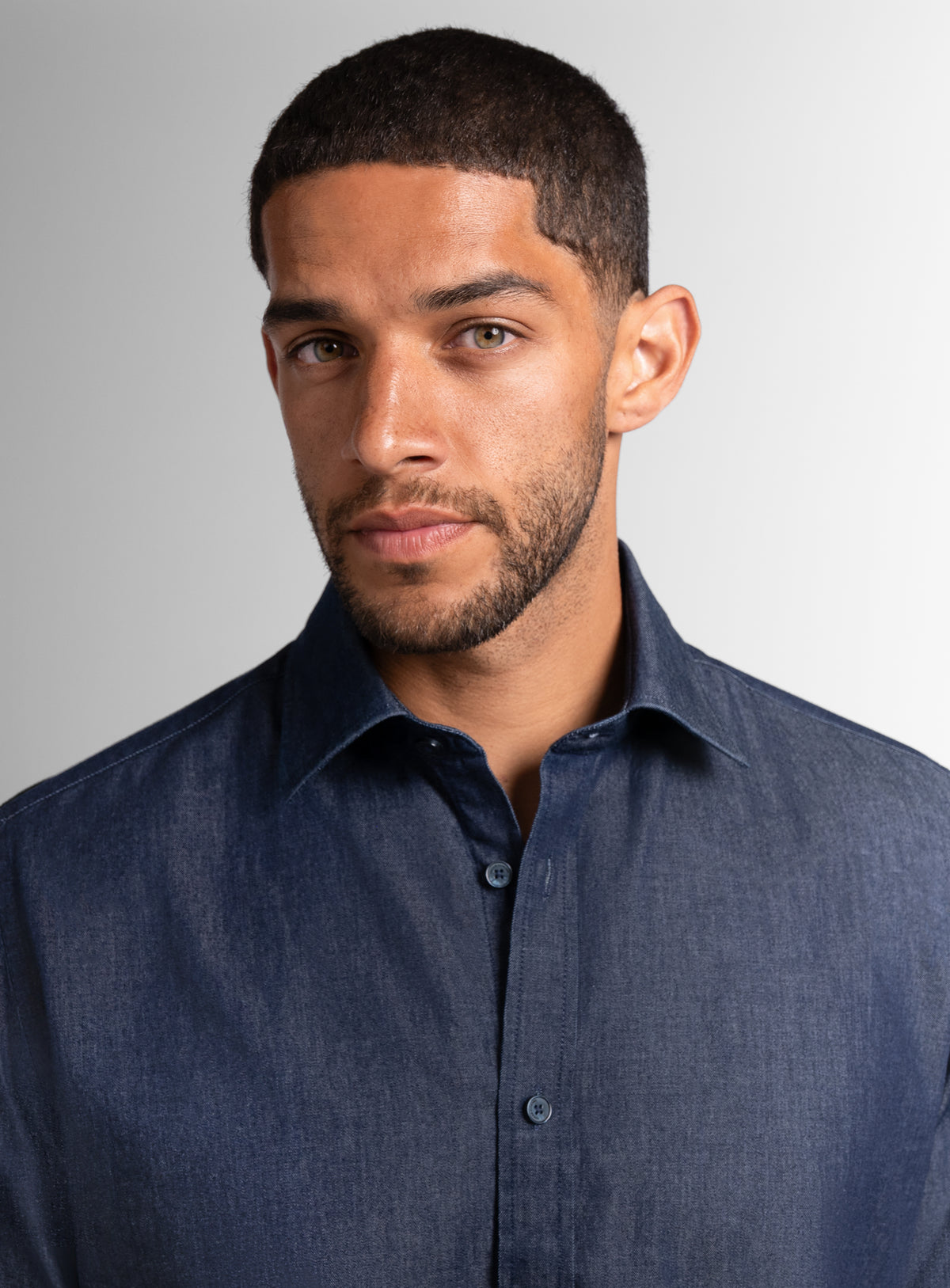A close-up of a man wearing the Piero Denim Indigo Blue Slim Fit Shirt