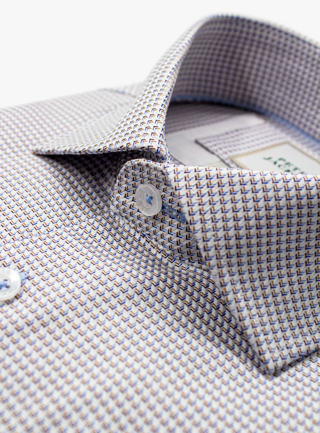 Close-up of a patterned shirt collar with a button