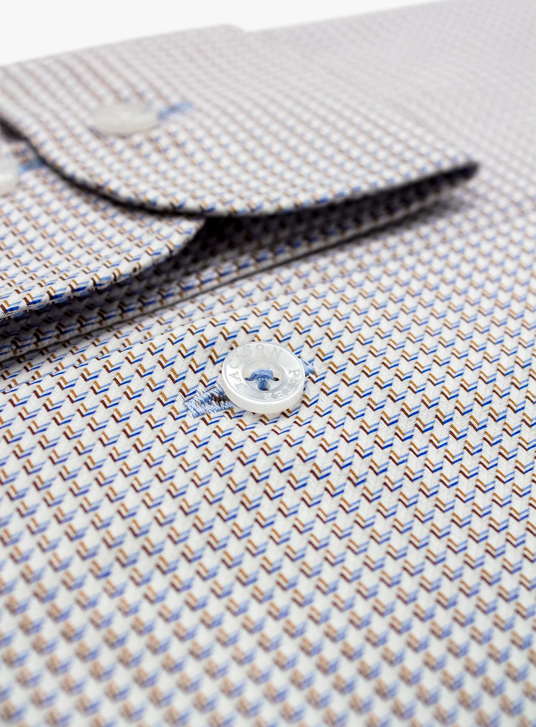 Close-up of a patterned shirt with a button, focusing on texture and design.