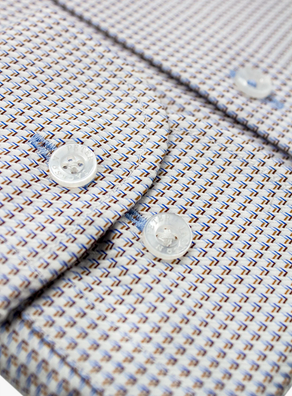 Close-up of a patterned shirt with buttons