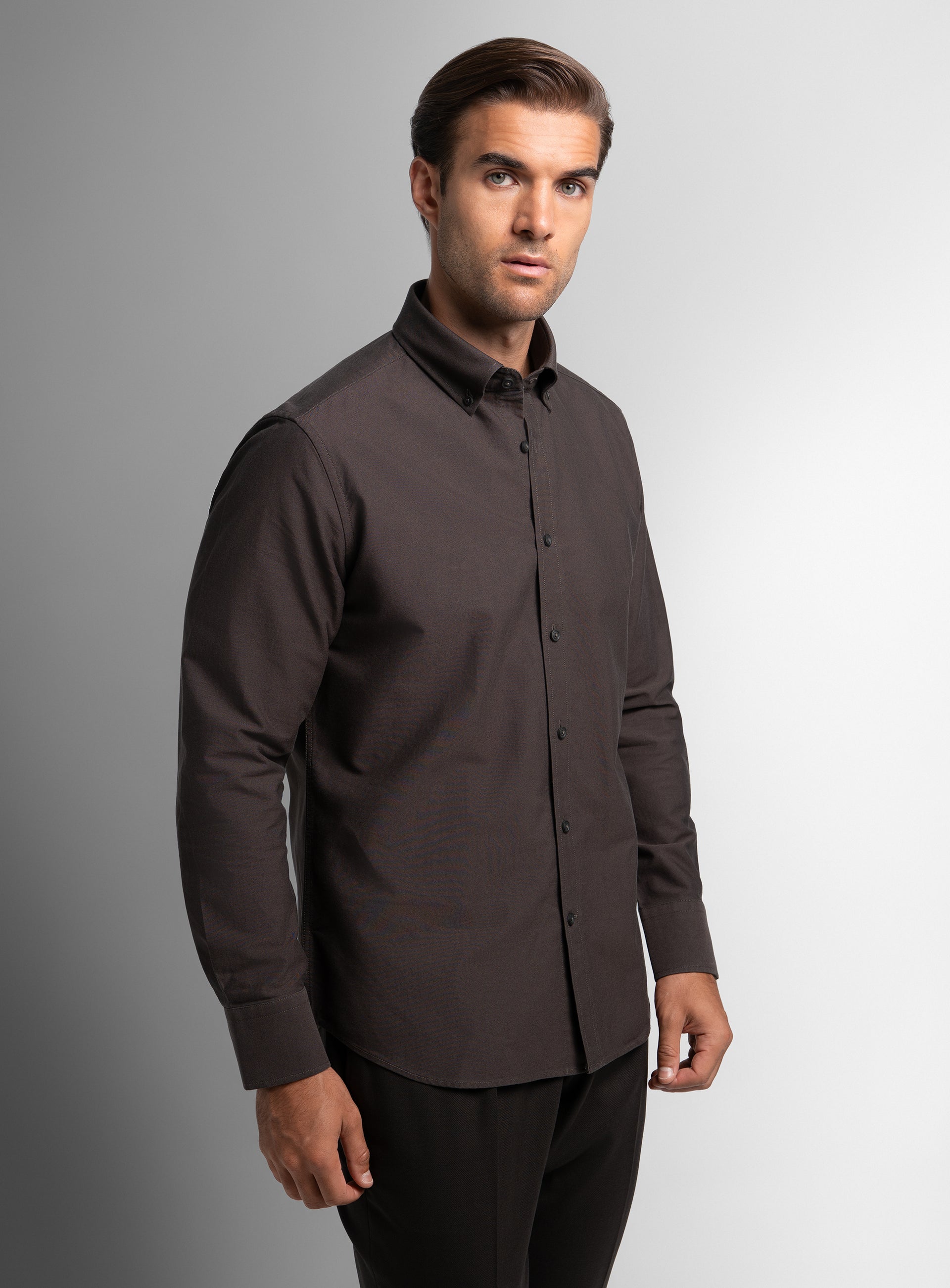 A man wearing the Paolo Oxford Slim Fit Brown Shirt