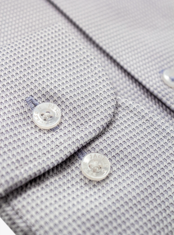 Close-up of a gray textured shirt with buttons