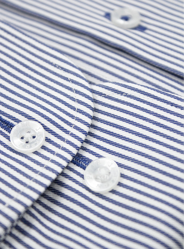 Close-up of a blue and white striped shirt with buttons.