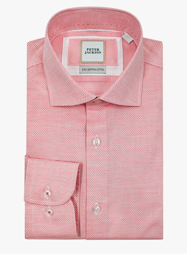 Pink dress shirt with a Peter Jackson label on a white background