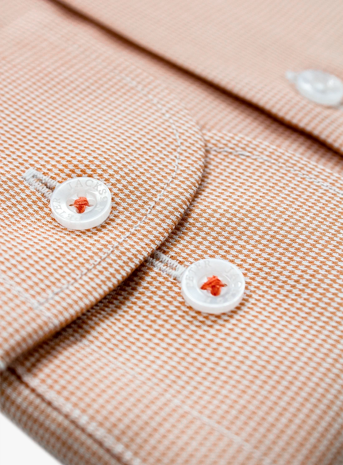 Close-up of a beige fabric with buttons
