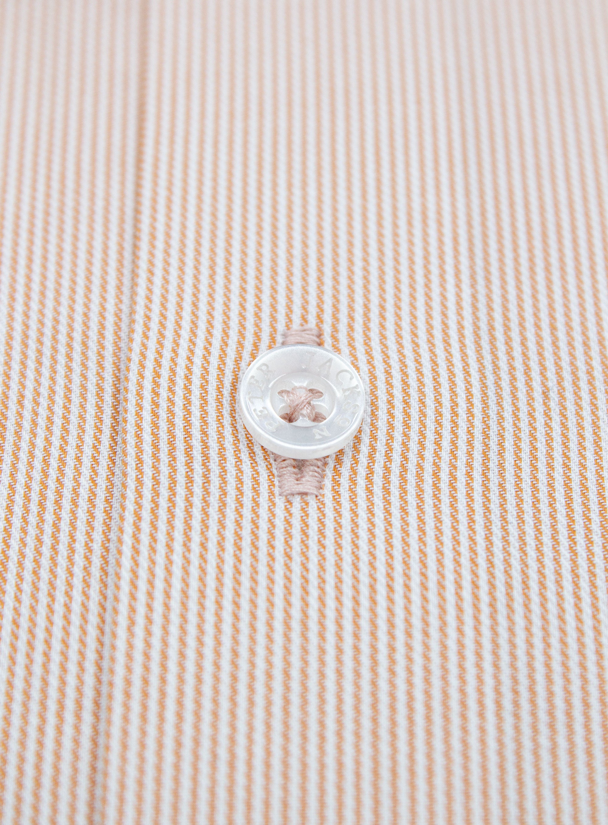 Close-up of the button on the Milan Fine Stripe Orange Shirt