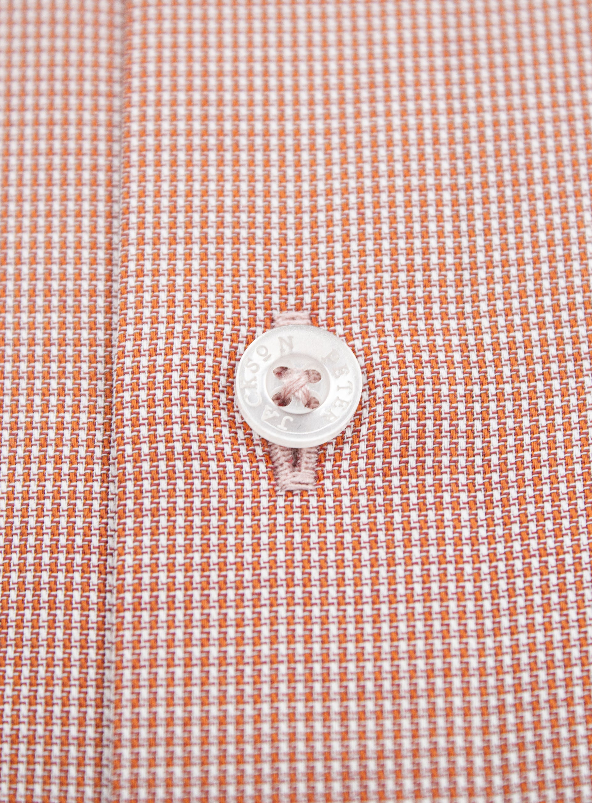 Close-up of a button on the Milan Micro Orange Shirt