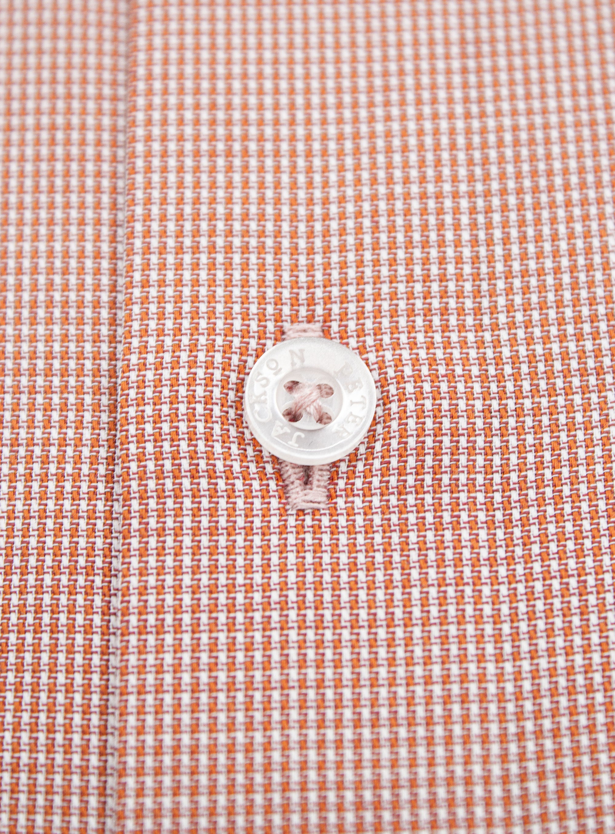 Close-up of a button on the Milan Micro Orange Shirt