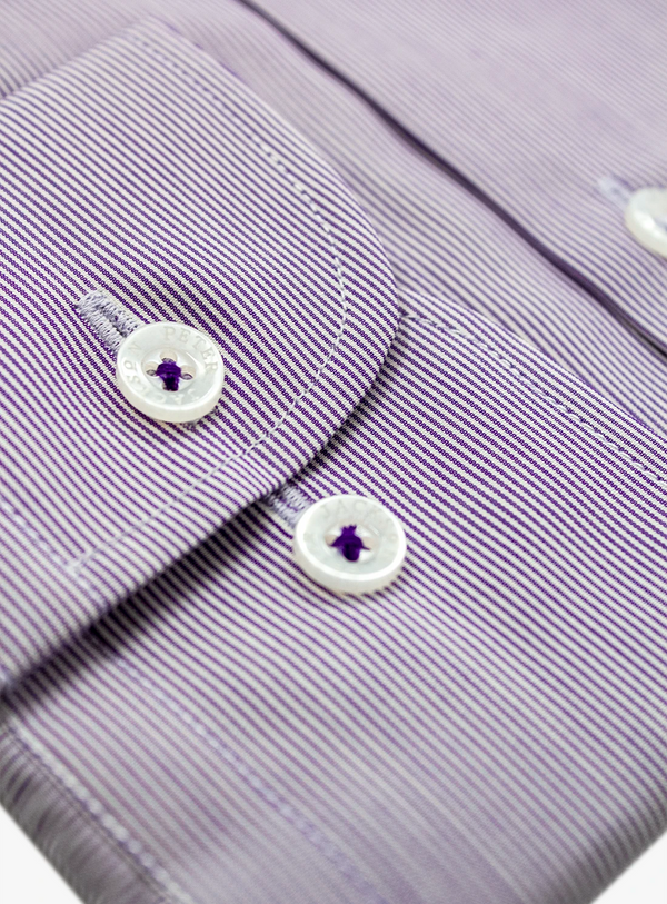 Close-up of a purple striped shirt with buttons on a white background