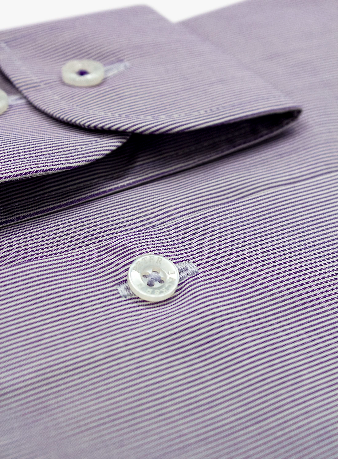 Close-up of a purple striped shirt with a button