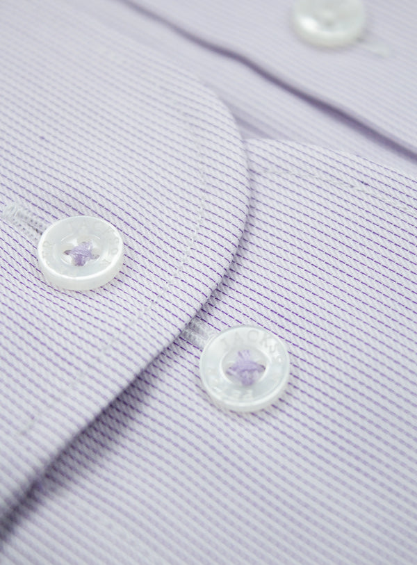 Close-up of a light purple shirt with buttons