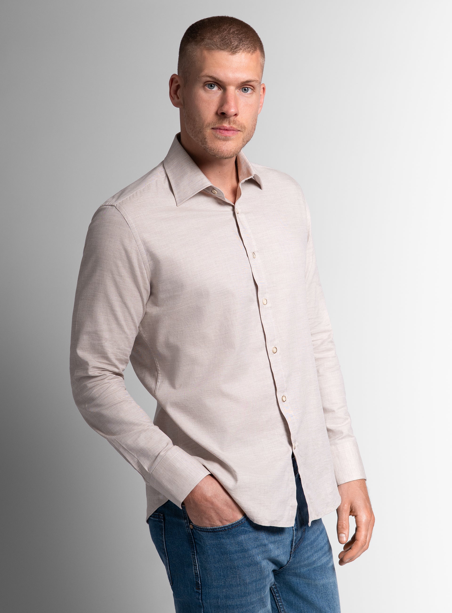 A man with his hand in his pocket, wearing the Piero Flannel Slim Fit Taupe Shirt