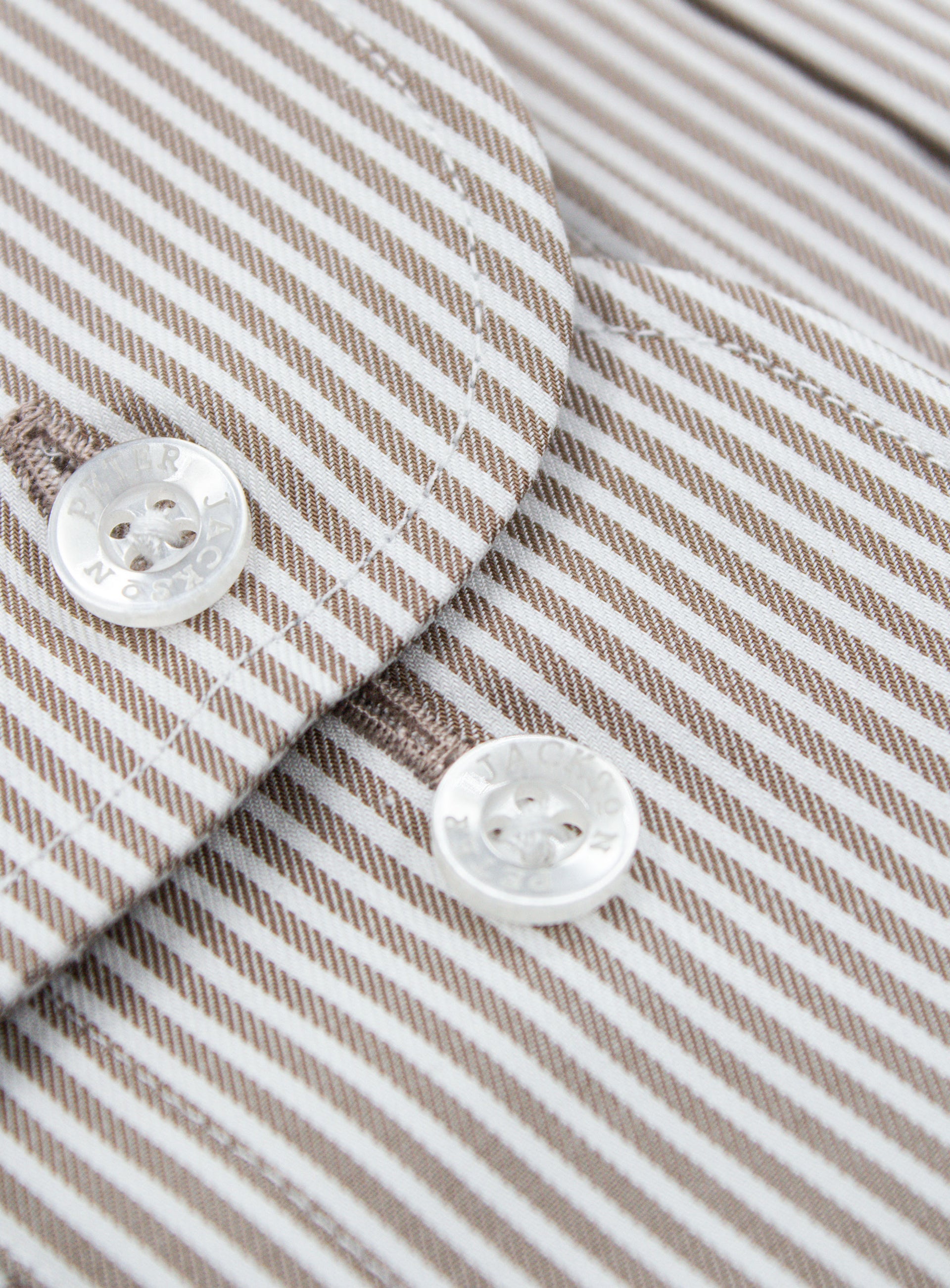 Close-up of a button on the Florence Chocolate Brown Stripe Shirt