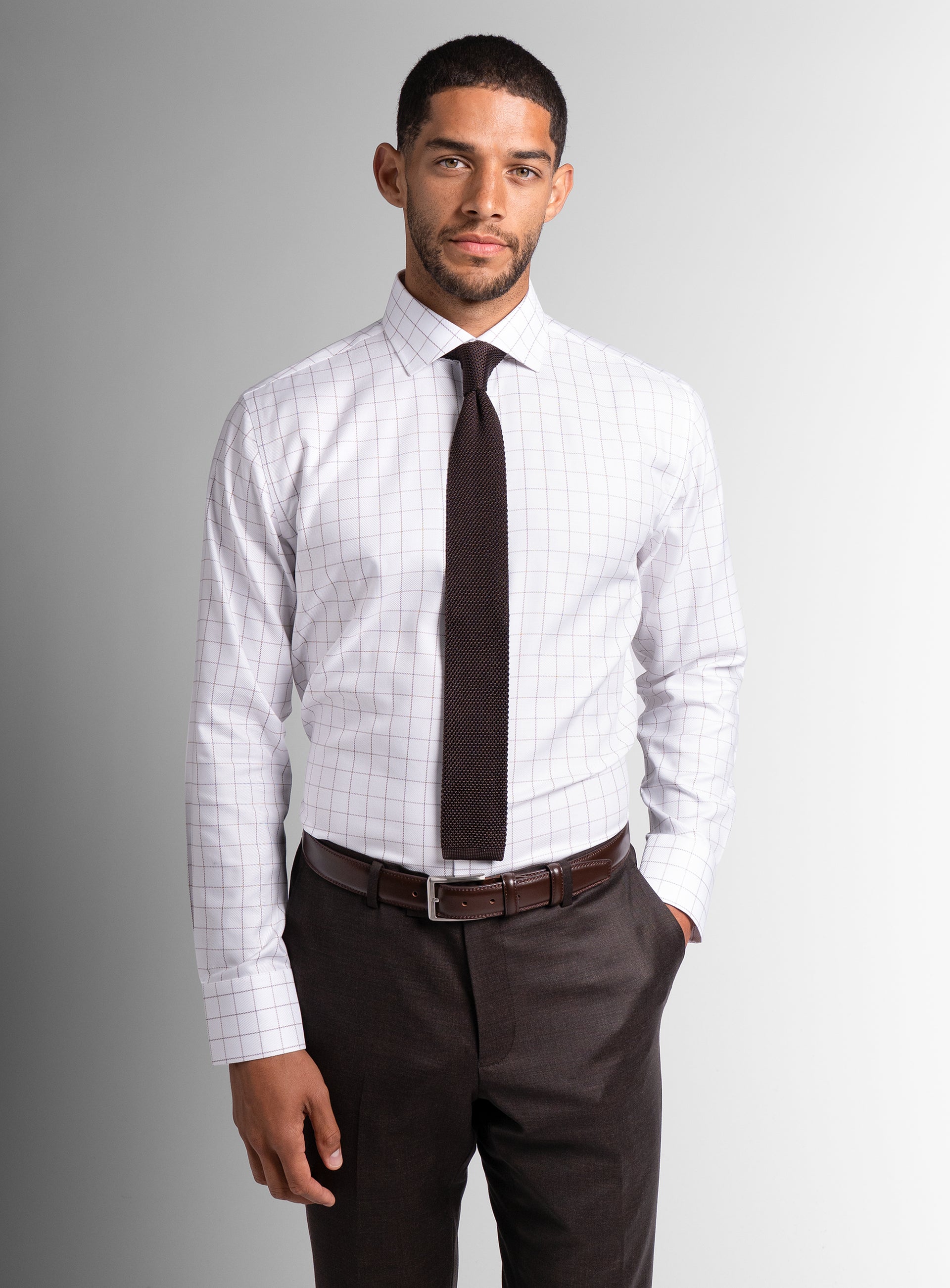 Front-view of a man wearing the Milan Twill Brown Mid-Check White Shirt
