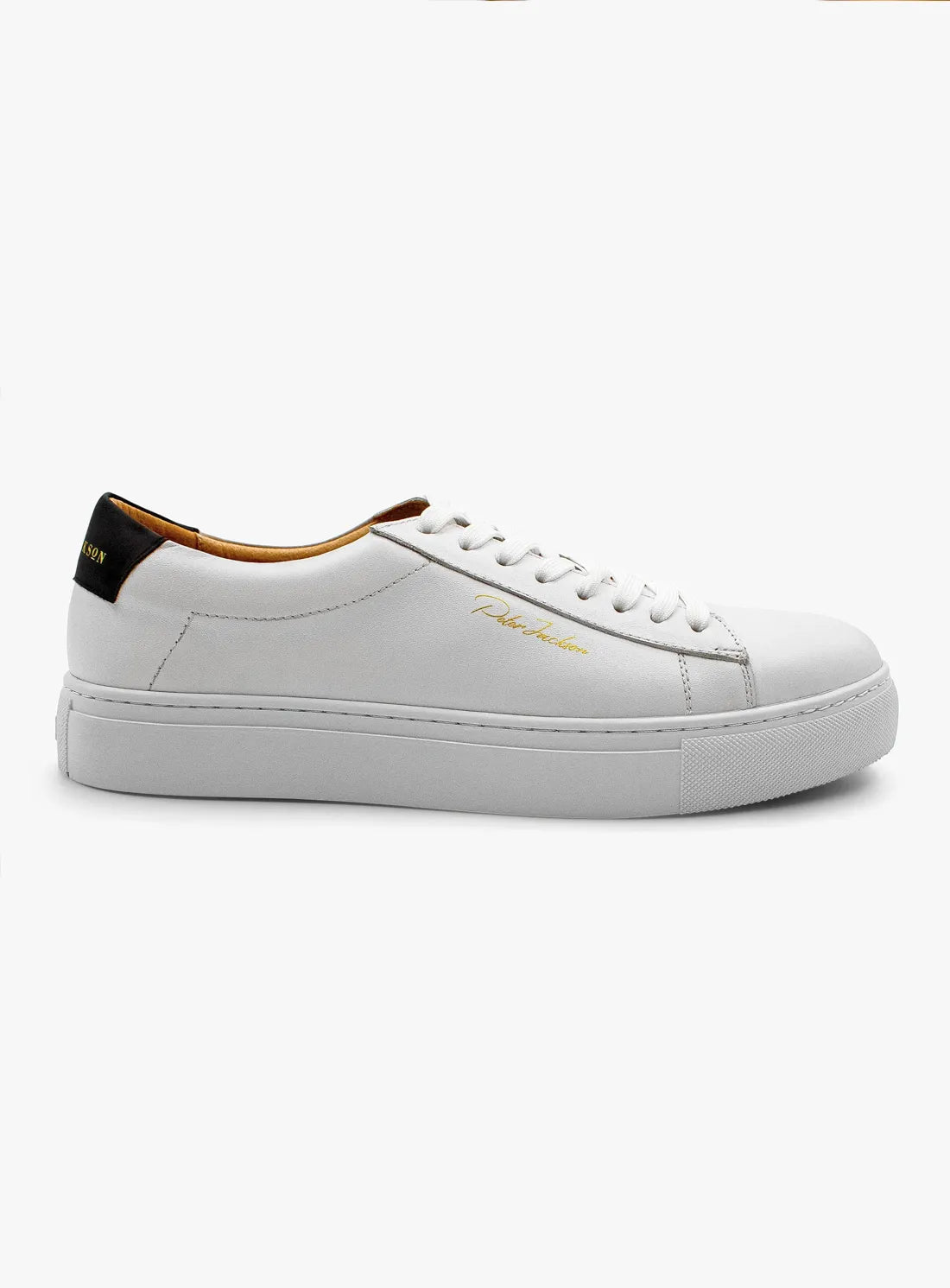 White sneaker with brown accents on a white background