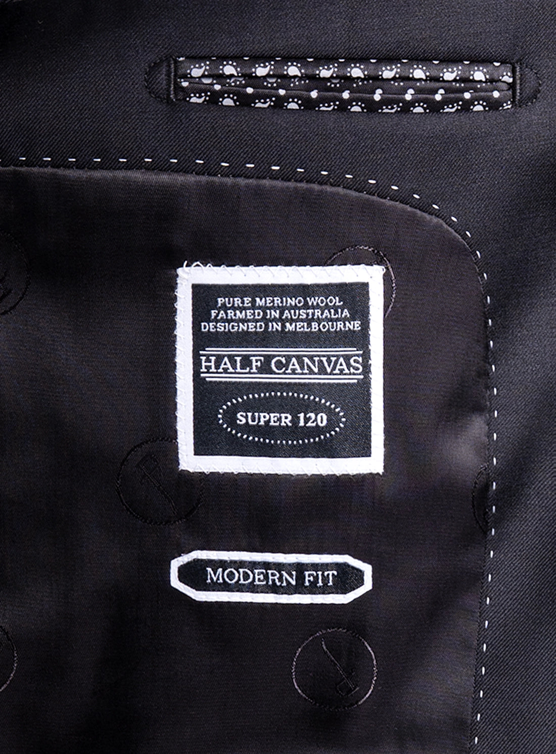 Label on a black suit jacket with 'Half Canvas' branding and text.