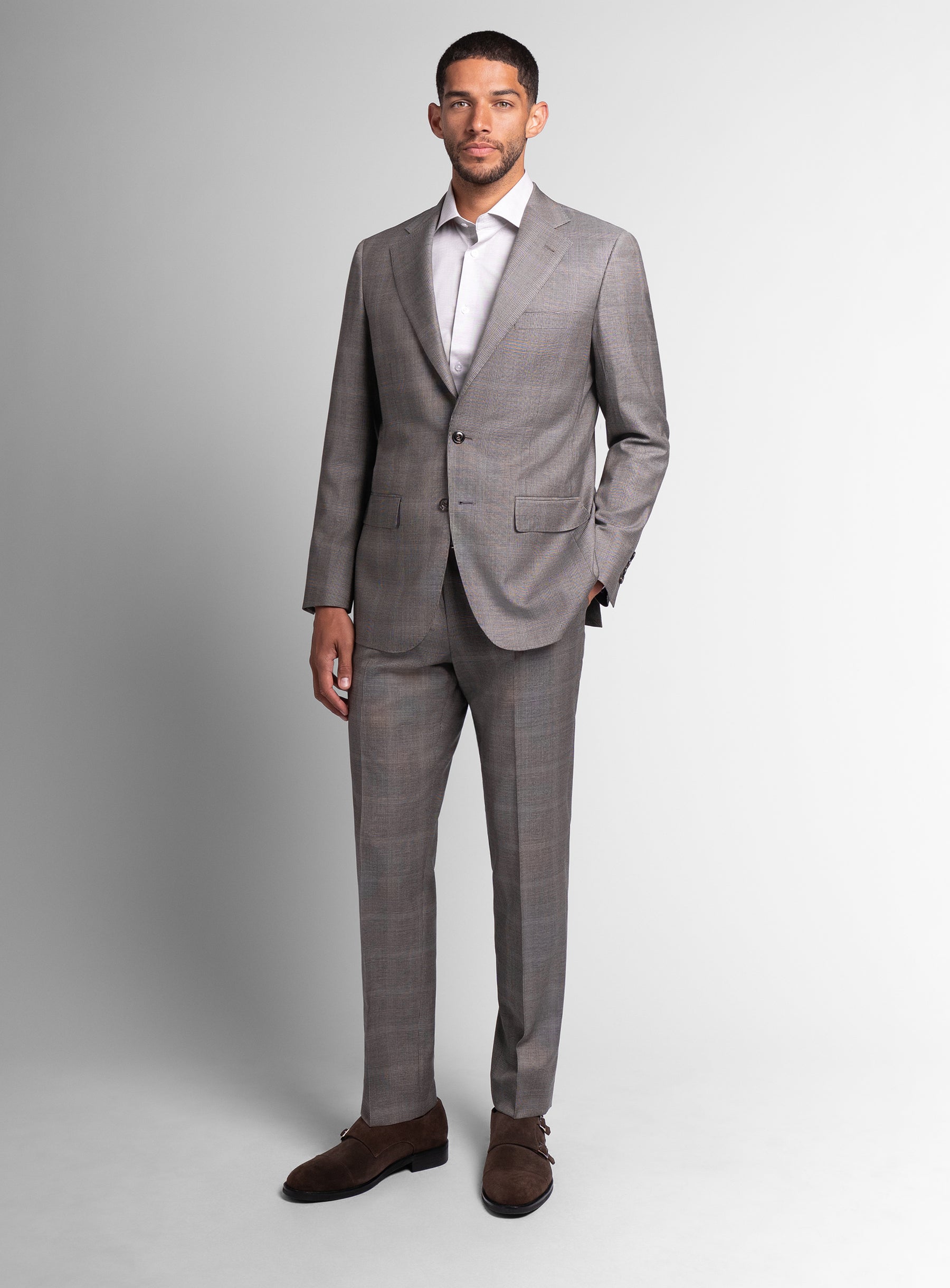 Man wearing the Belnades Plaid Taupe Brown Suit
