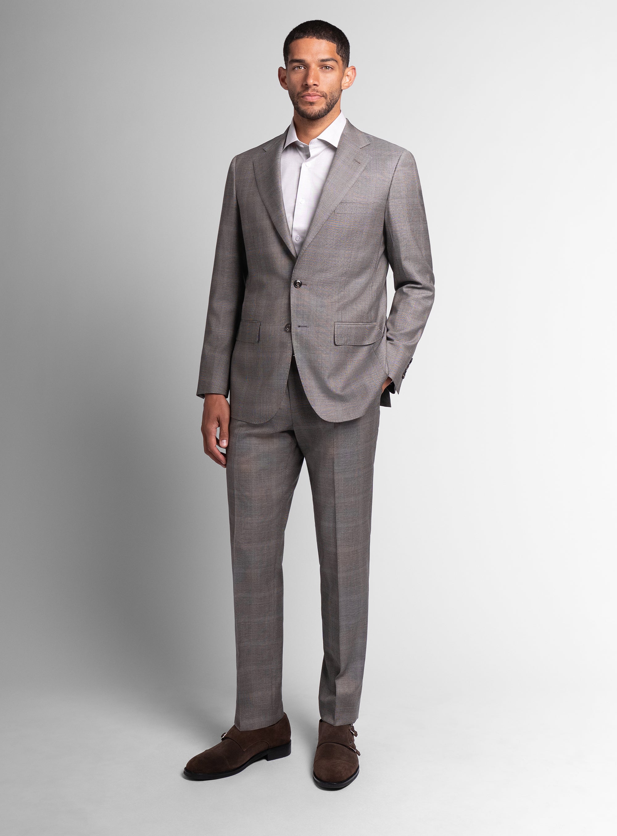 Man wearing the Belnades Plaid Taupe Brown Suit