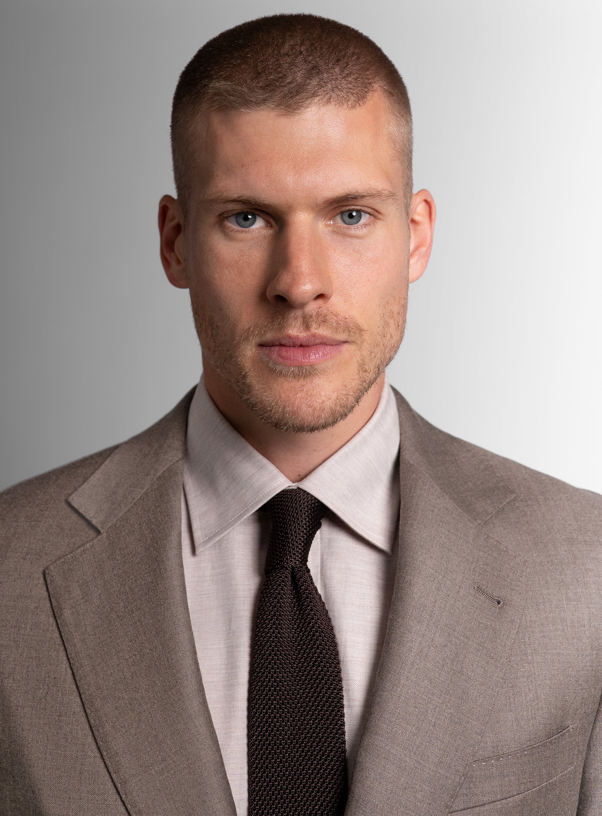 Close-up of man wearing the Tattaglia Twill Taupe Suit