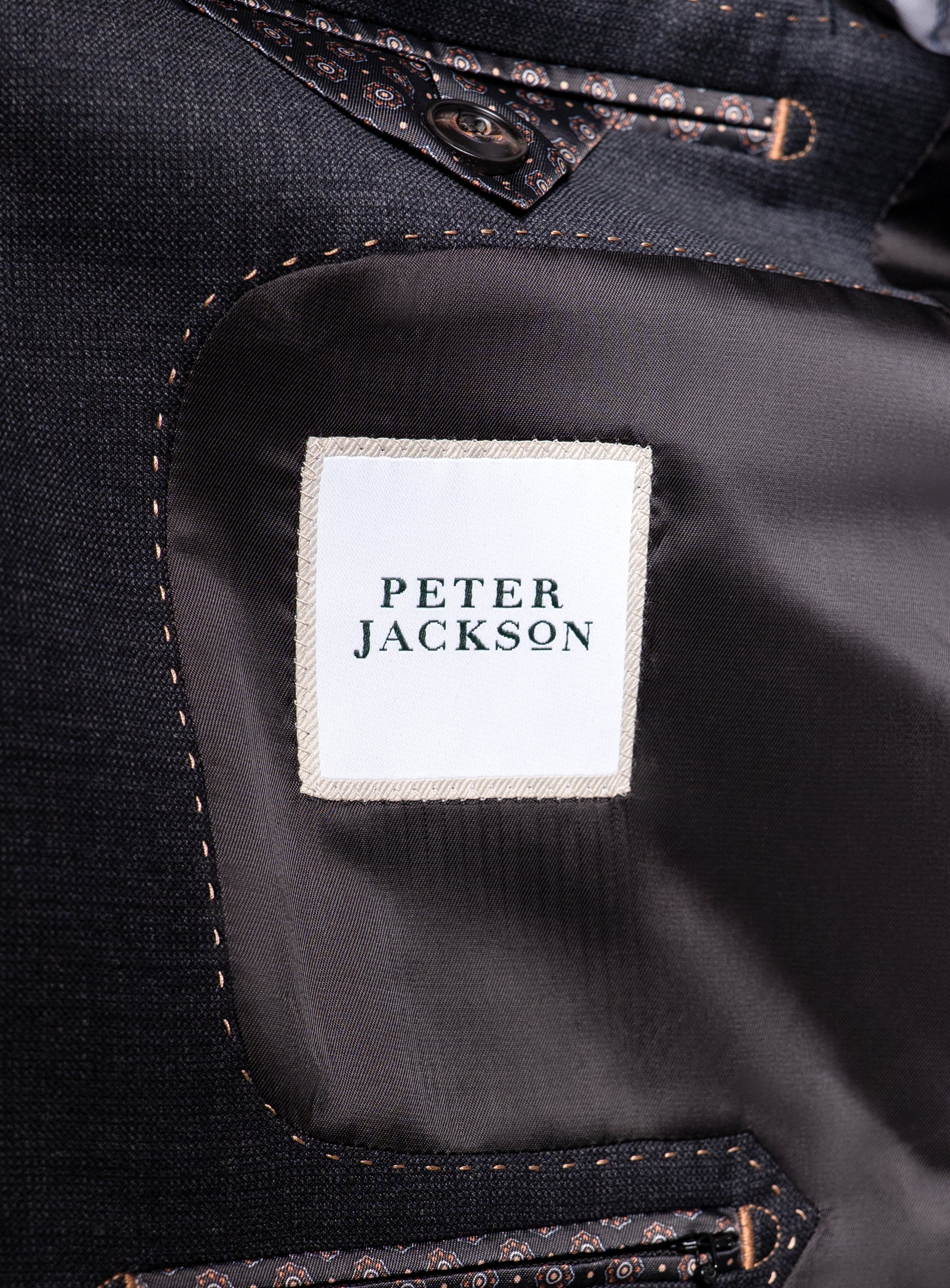 The "Peter Jackson" logo on the Belmondo Charcoal Grey Suit