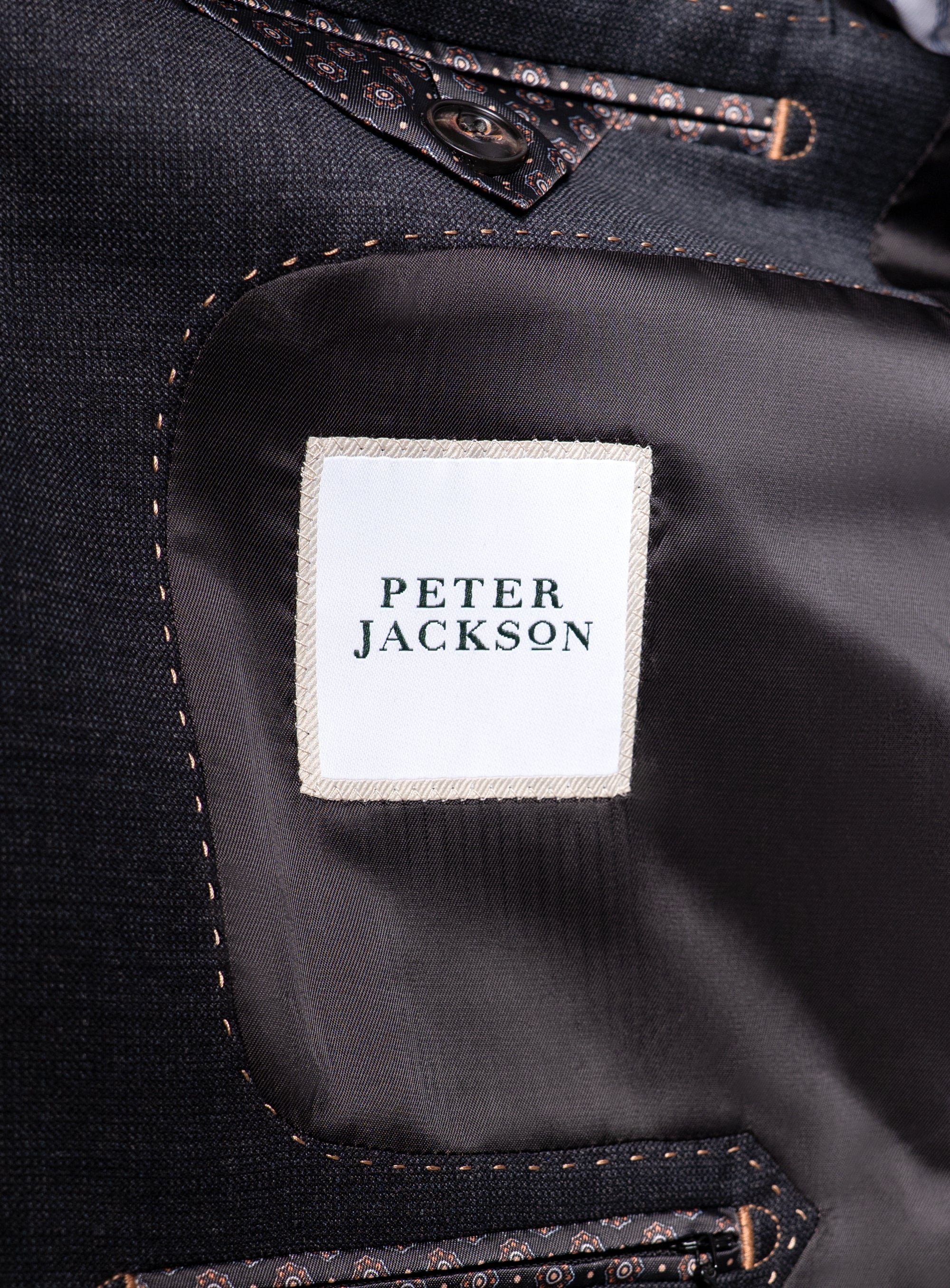 The "Peter Jackson" logo on the Belmondo Charcoal Grey Suit