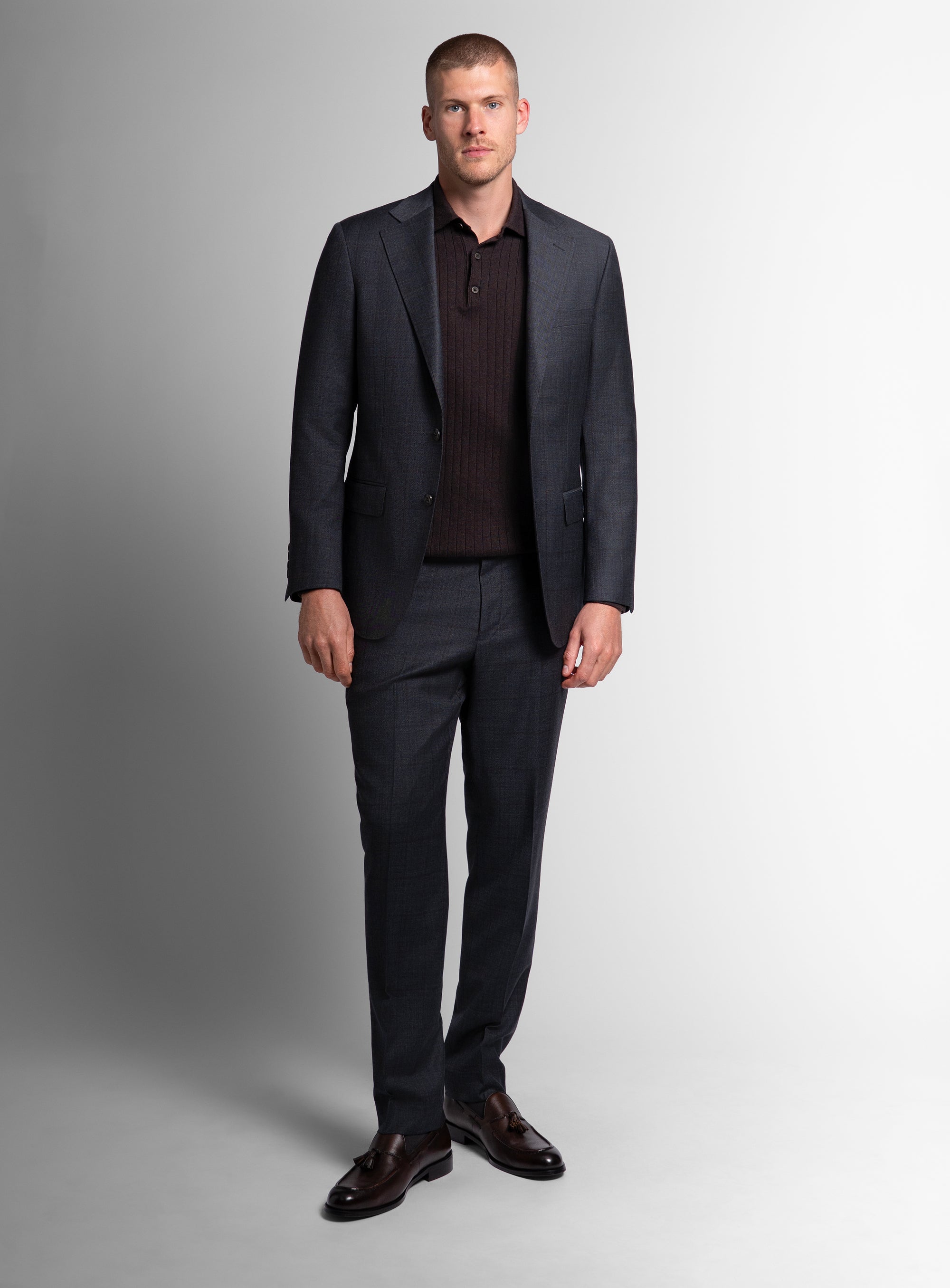 Man wearing the Auditore Check Charcoal Grey Suit