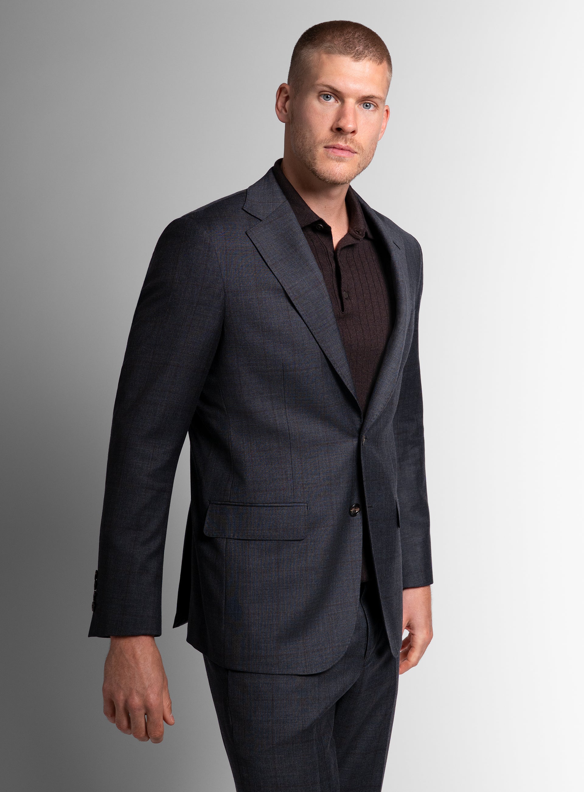 Man wearing the Auditore Check Charcoal Grey Suit